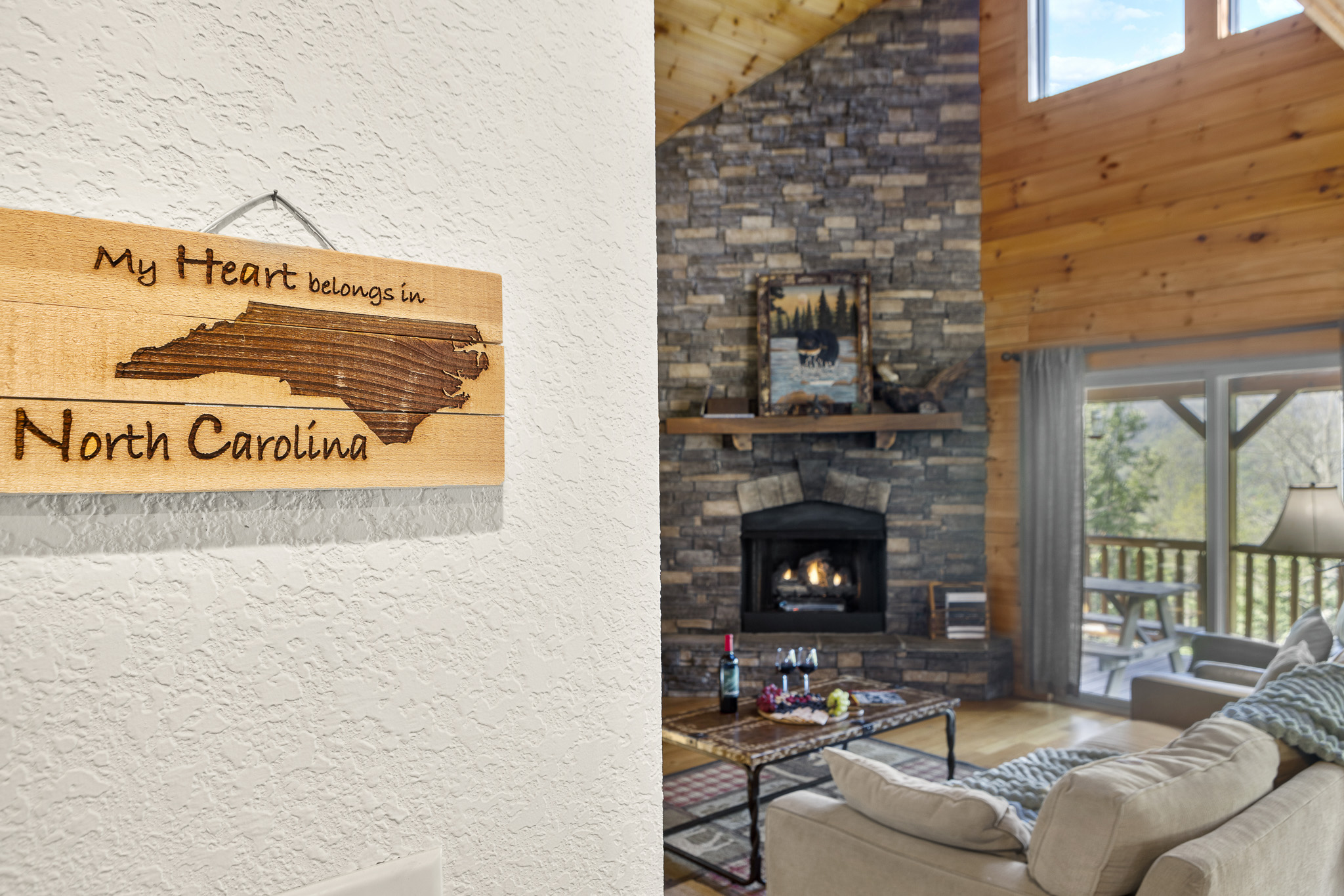 Living Room: Experience mountain charm with a stone fireplace and stunning views! Relax and unwind!