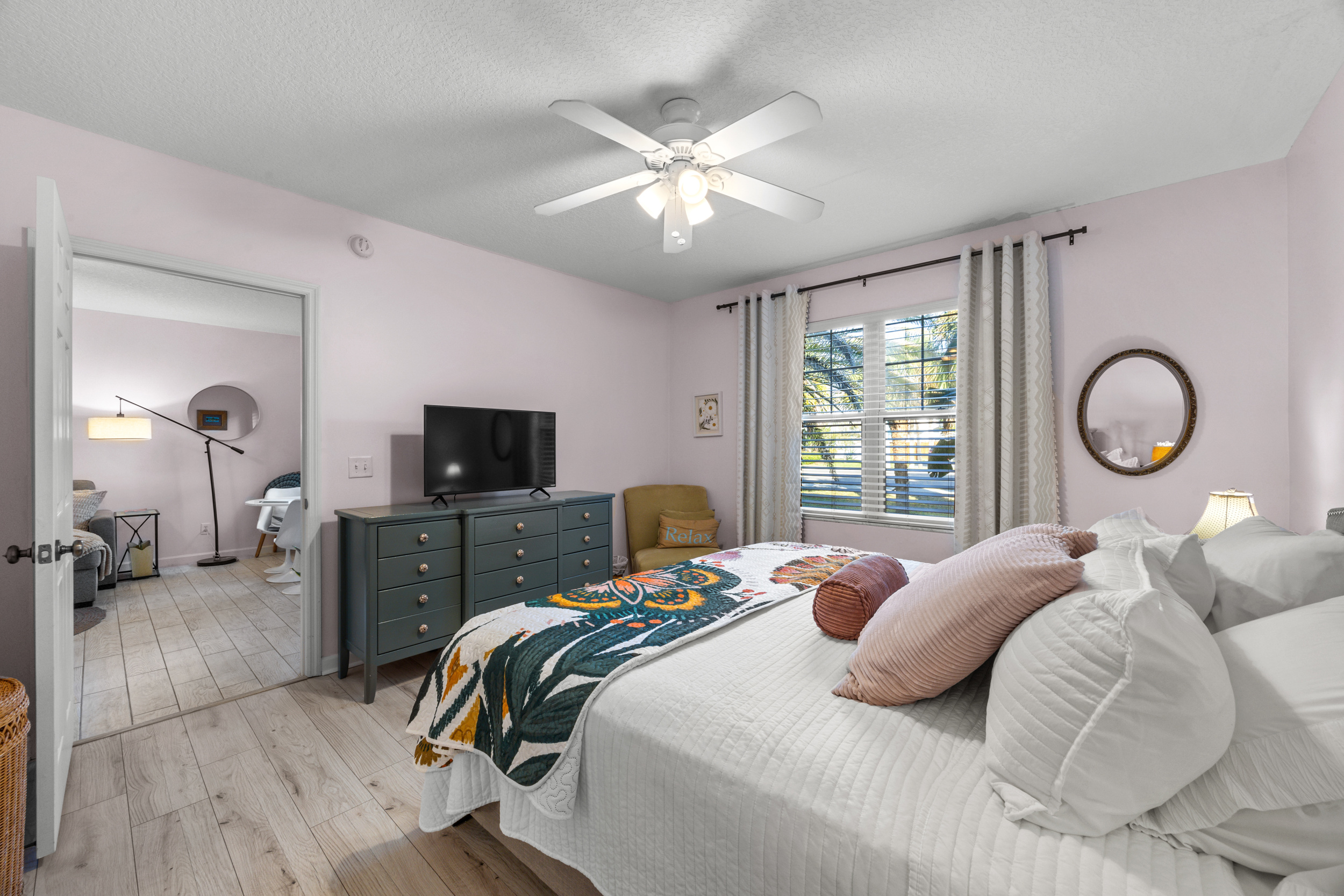 Inviting bedroom with modern décor and a peaceful, calming color palette.