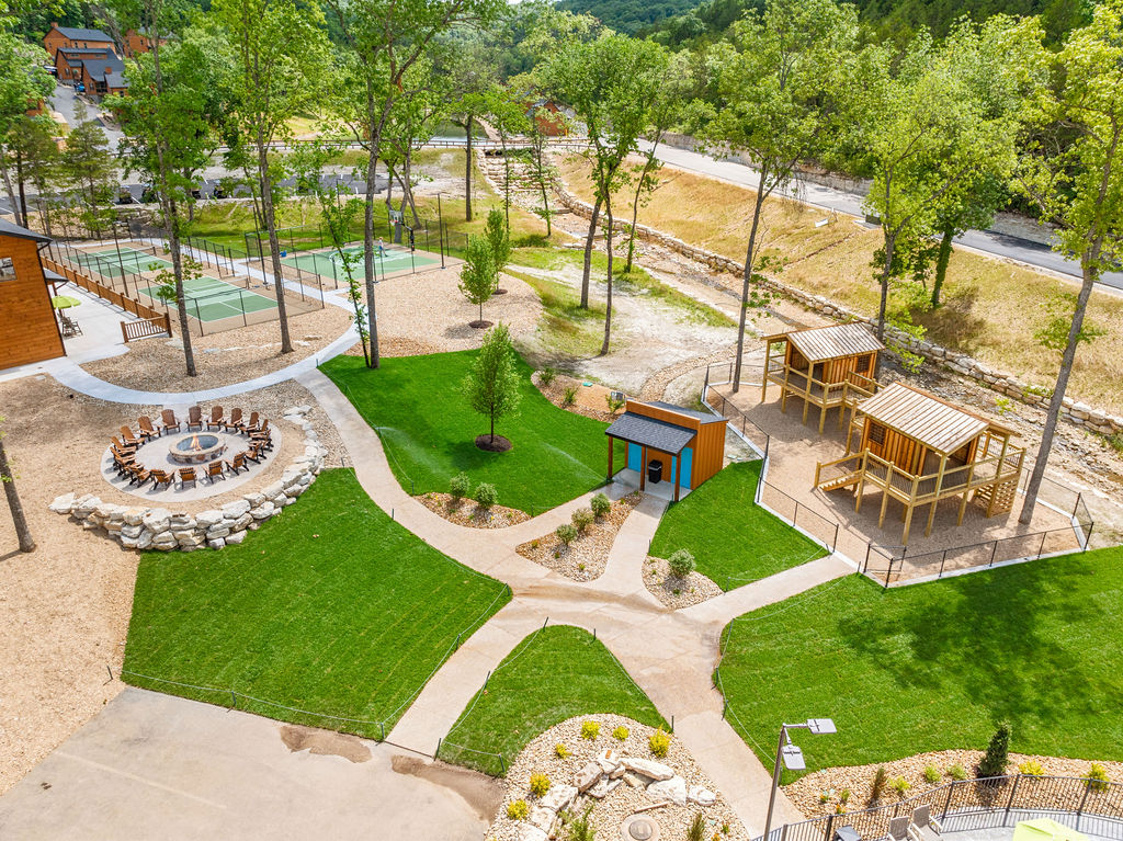 The center of family fun by the pools, courts, play houses and firepit
