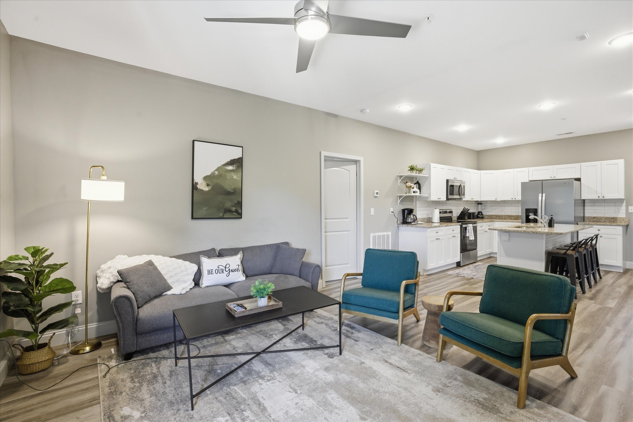 Stretch out and settle in—Unit 5’s living room gives you plenty of seating and a TV that makes it easy to wind down together.