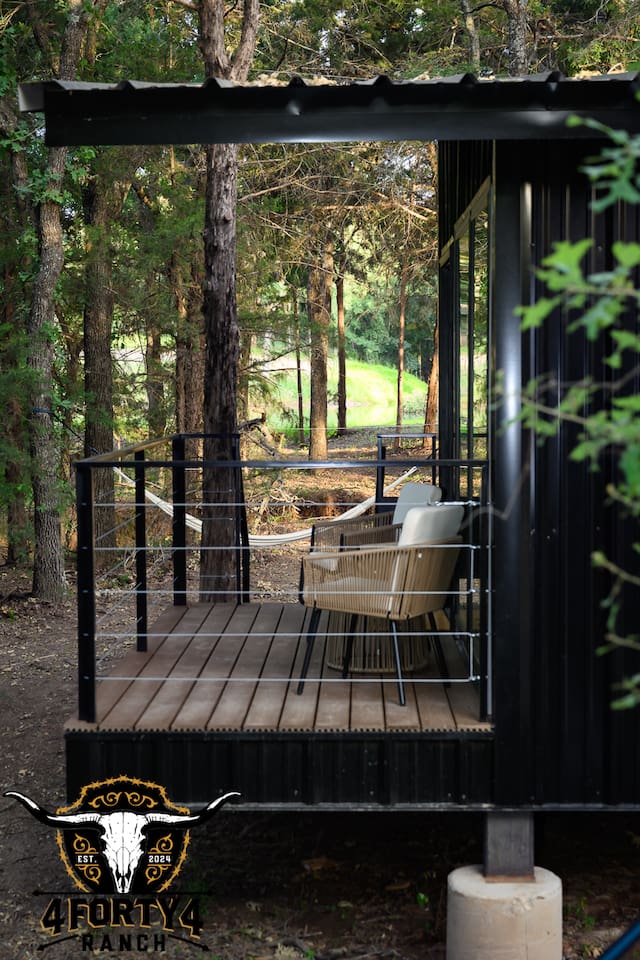 Your patio with a view of the pond through the trees.