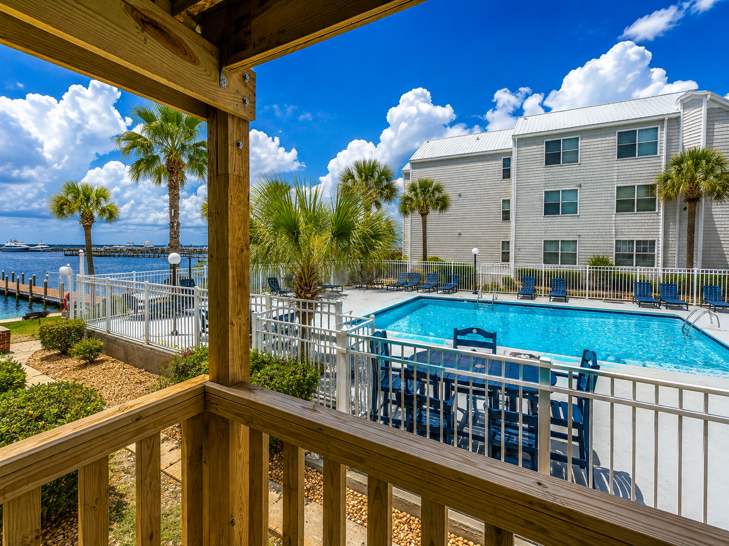 Step onto the balcony and enjoy views of the pool, palm trees and bay—all part of the laid-back Hermitage experience.