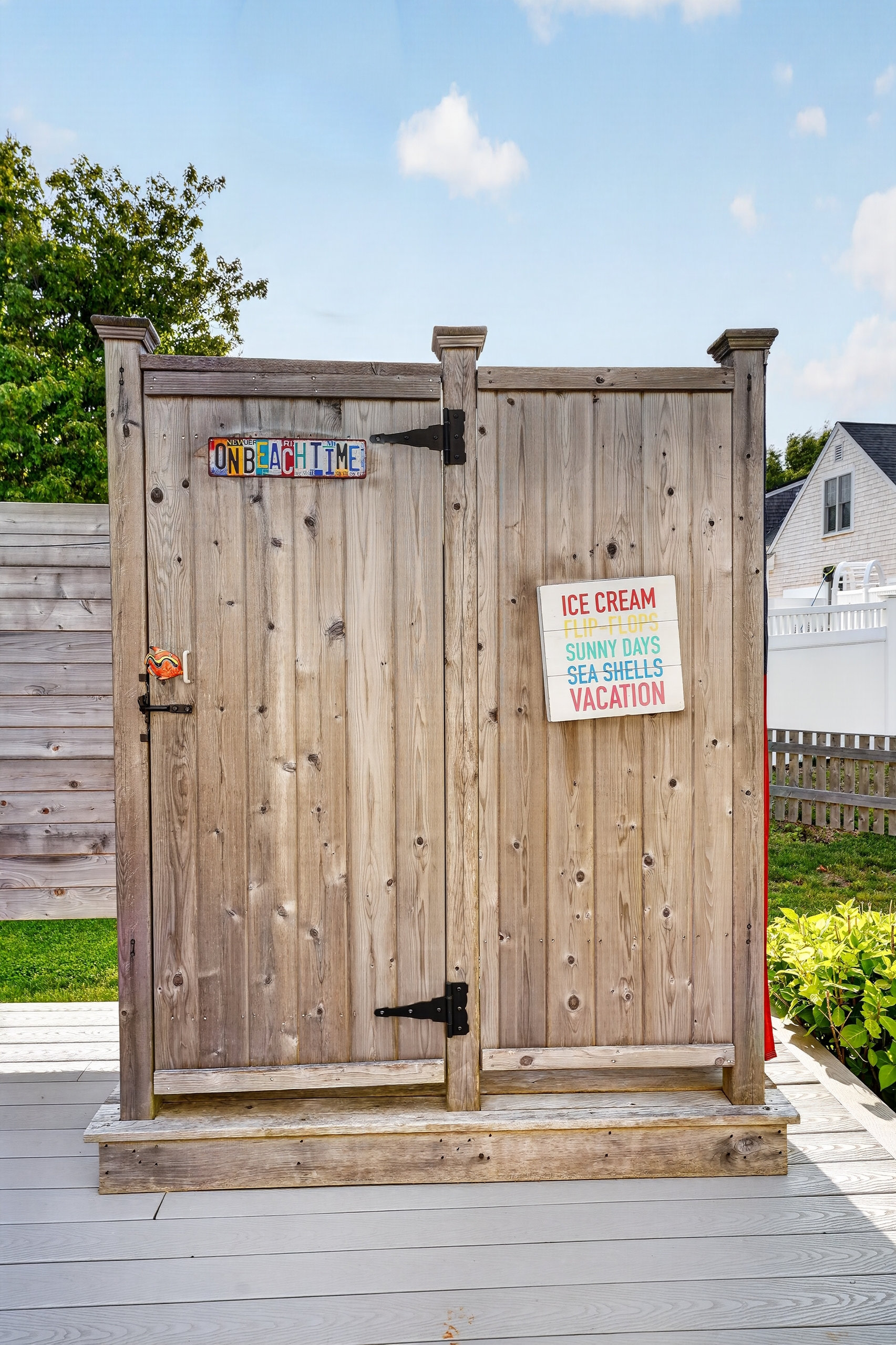 Private enclosed outdoor shower—perfect for rinsing off after the beach while keeping sand outside.