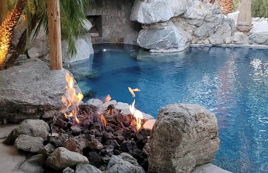 Enjoy the gas firepit and waterfall cave, I mean "grotto!"