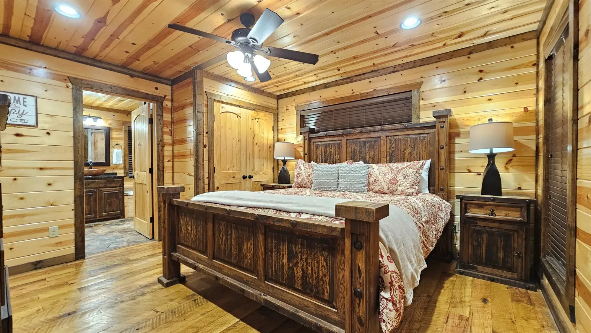 Bedroom 2: Rustic charm with wooden accents and plush bedding for a perfect getaway!