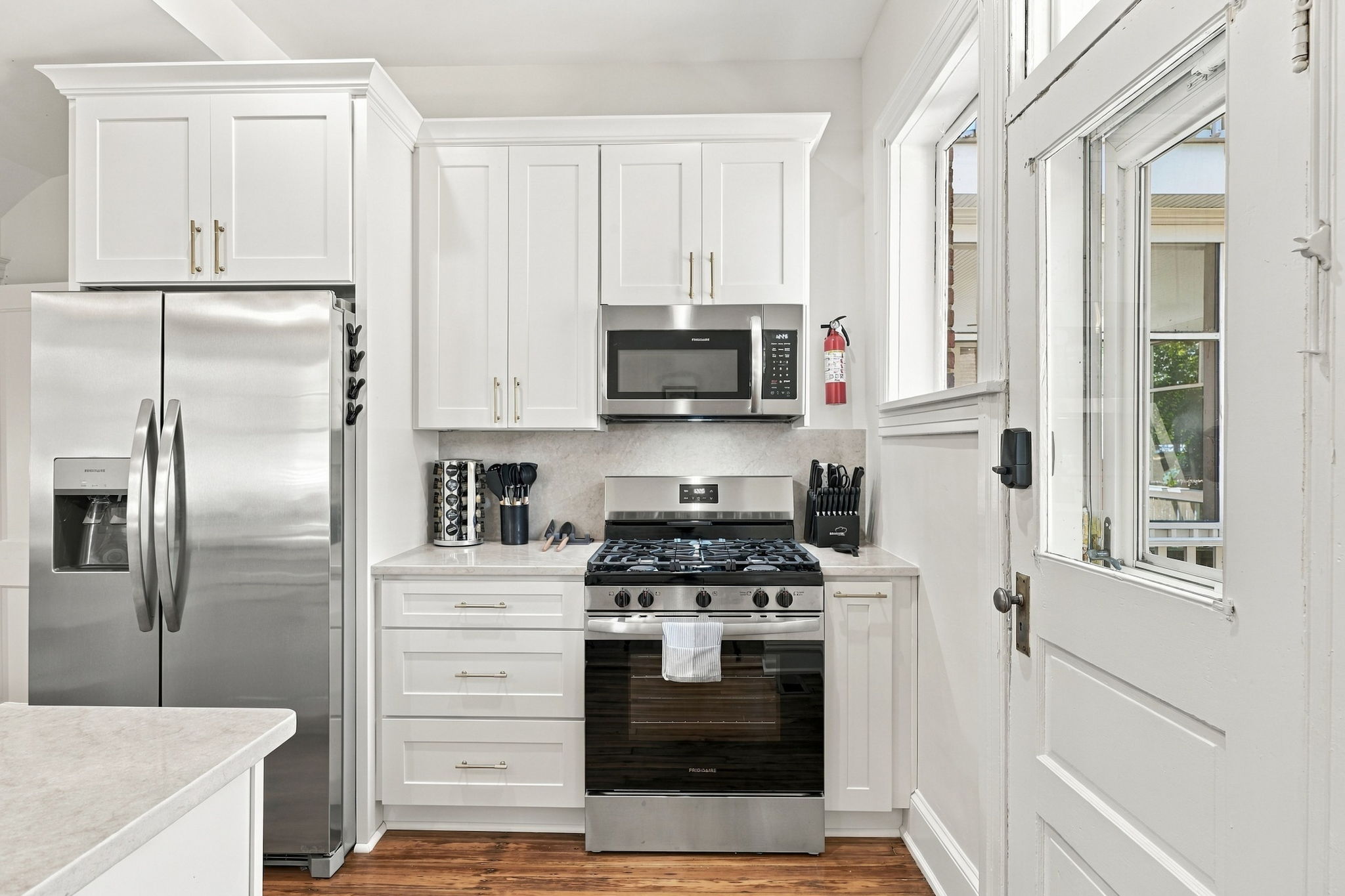 Kitchen Delight: Cook up a storm in this bright, modern kitchen with stainless steel appliances!