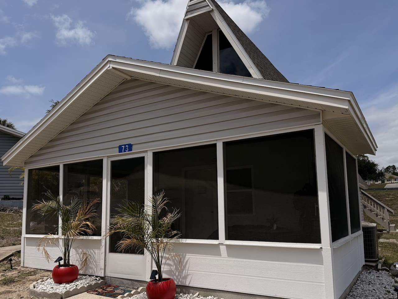 Simple "hidden in plain sight" exterior -- don't let the unassuming aesthetic fool you, the interior of Mario's Mini Mansion place is absolutely LIT!