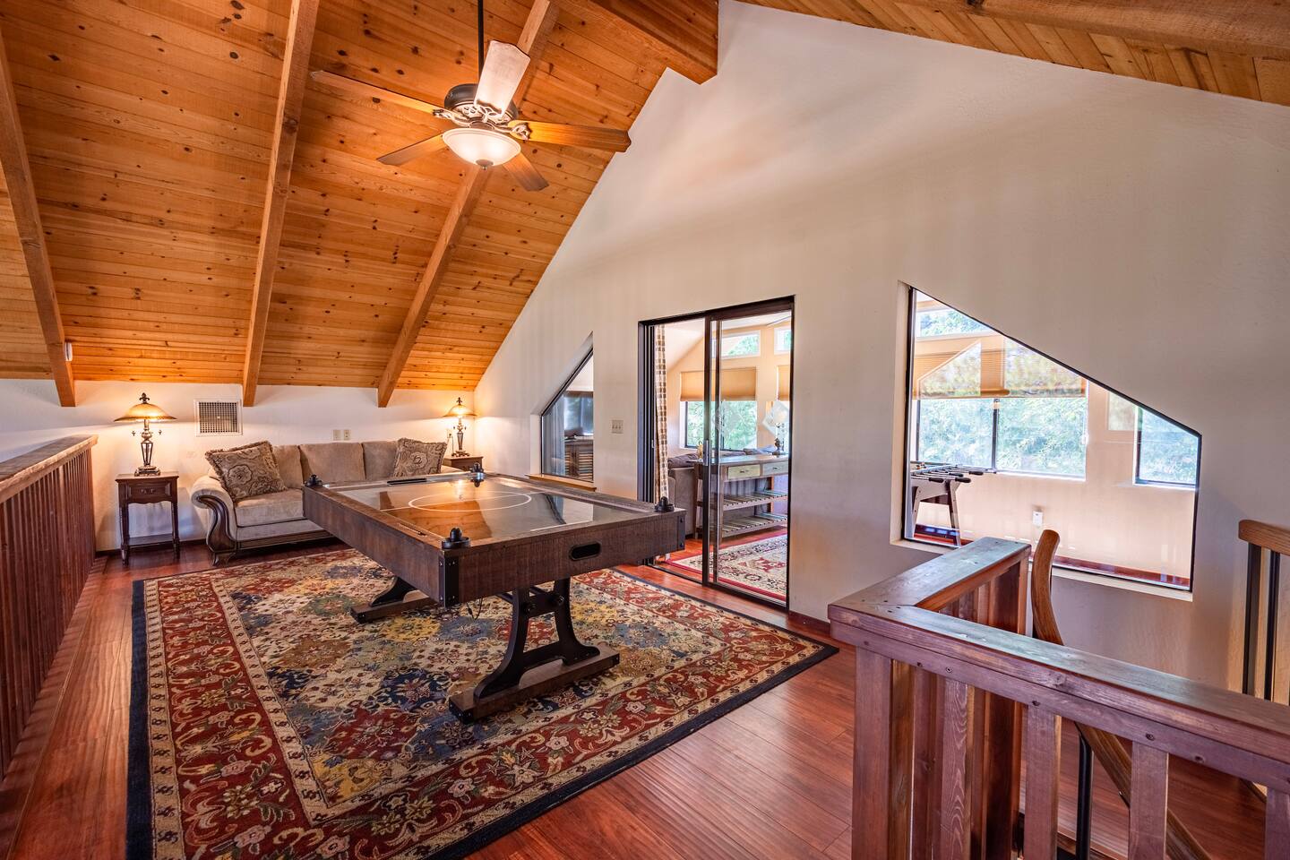 Loft with queen sofa sleeper and air hockey table