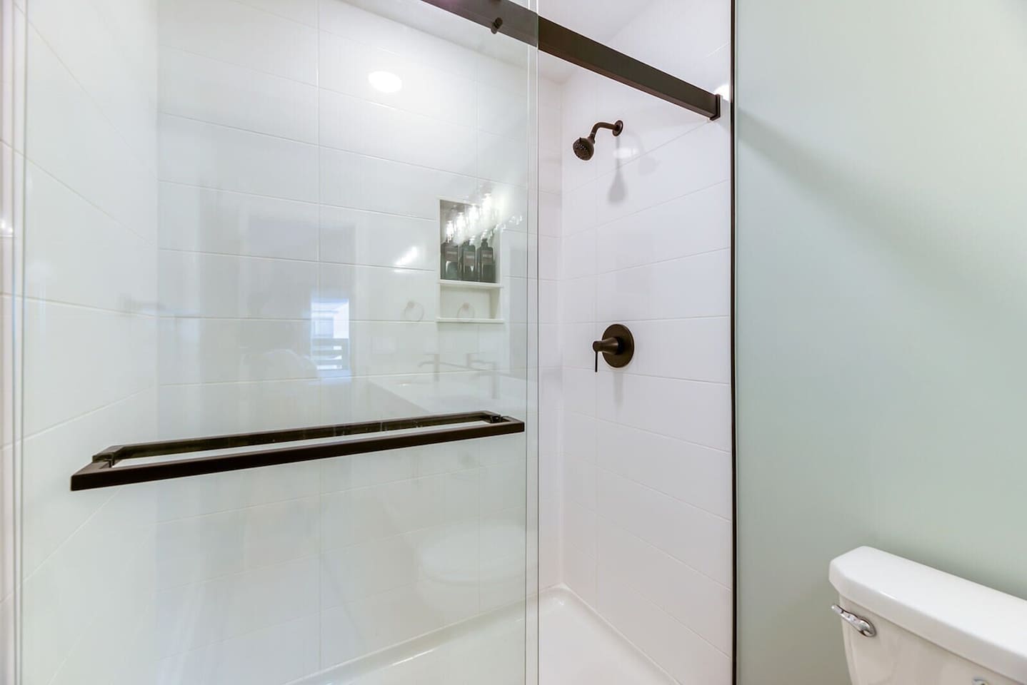 Walk-in shower in primary bath -- beautiful full bathroom with a large tiled shower.