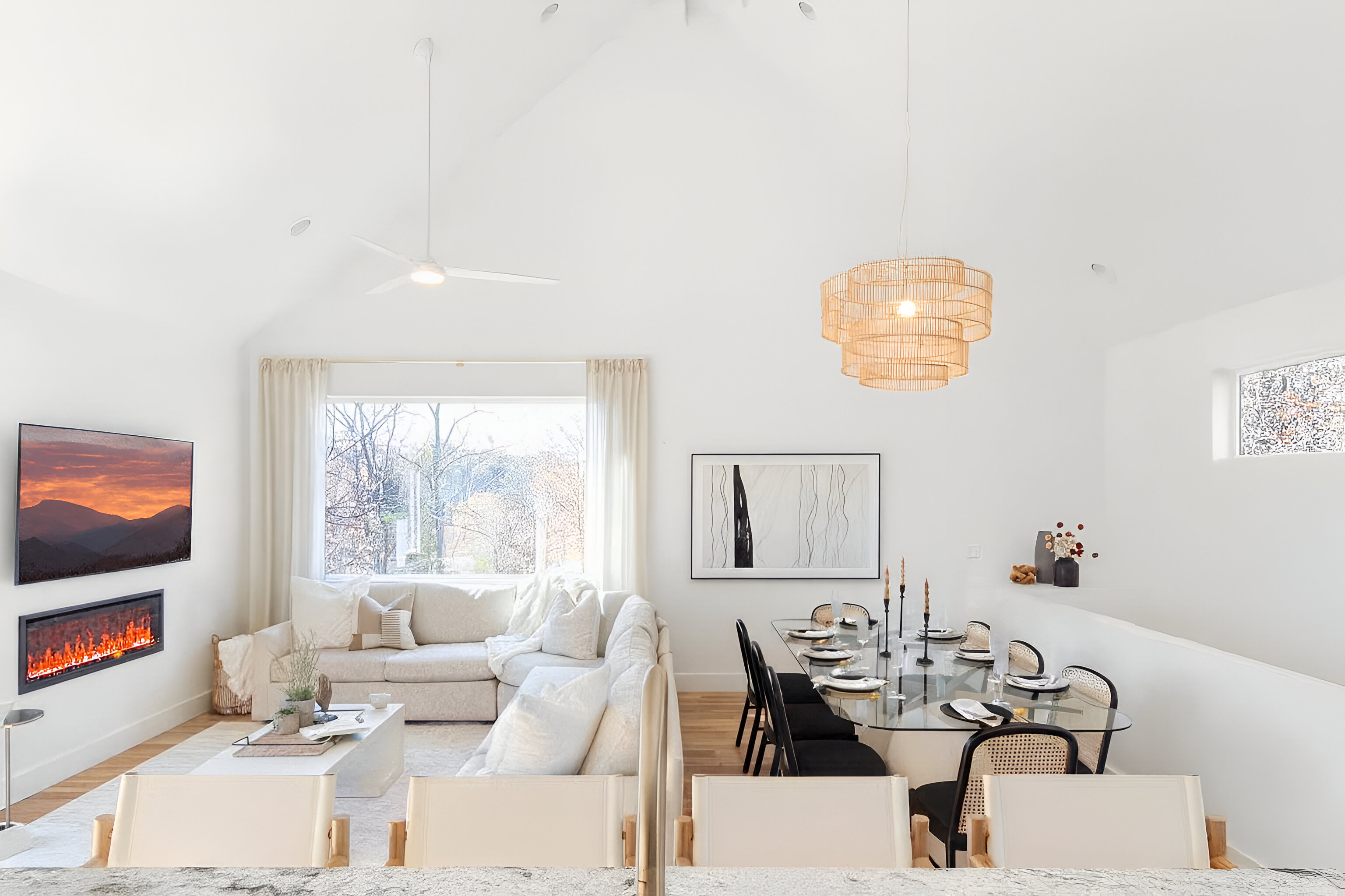 {Great Room} The Gallery House great room is designed for connection—dining for 8, sun-lit mornings, long shared meals, and warm evenings gathered by the fire.