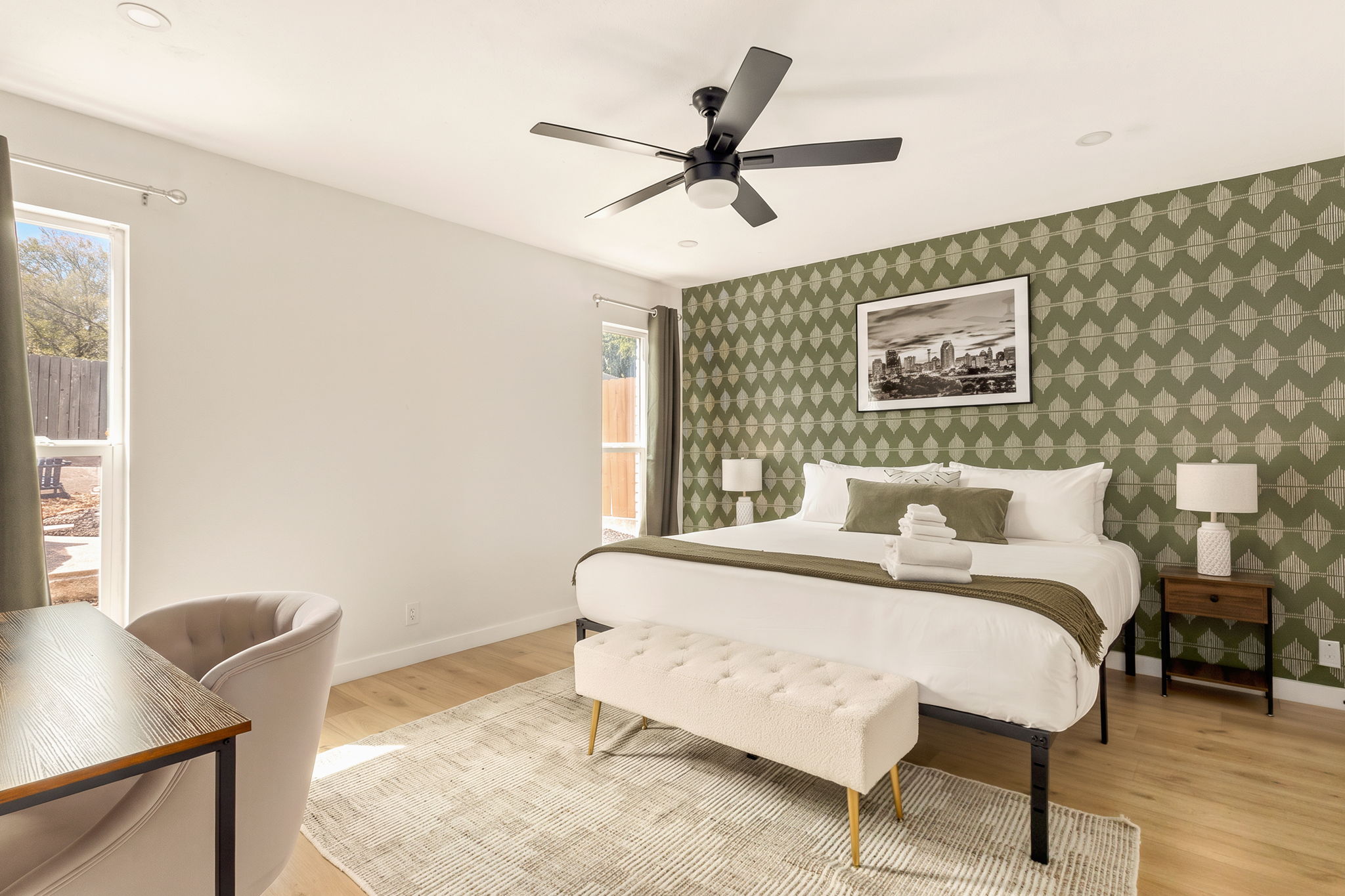 Spacious, airy bedroom with workspace and cozy touches for a restful stay ✨