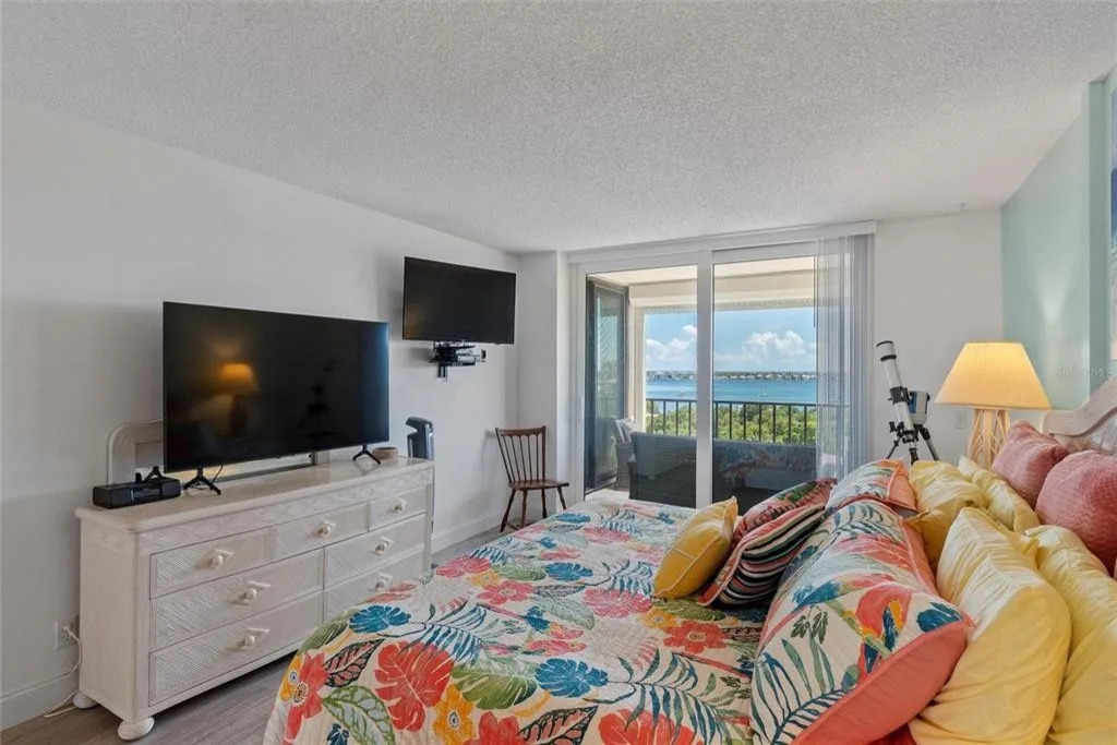 The master bedroom serves as a peaceful retreat with comfortable bedding and a calming bay area atmosphere—perfect for unwinding after a day at the beach or exploring Isla del Sol.