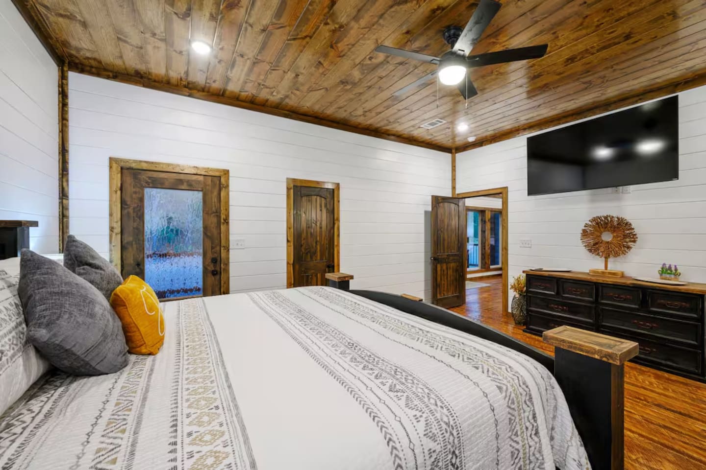 Comfort meets convenience: luxe bedding and a TV for the ultimate night-in.