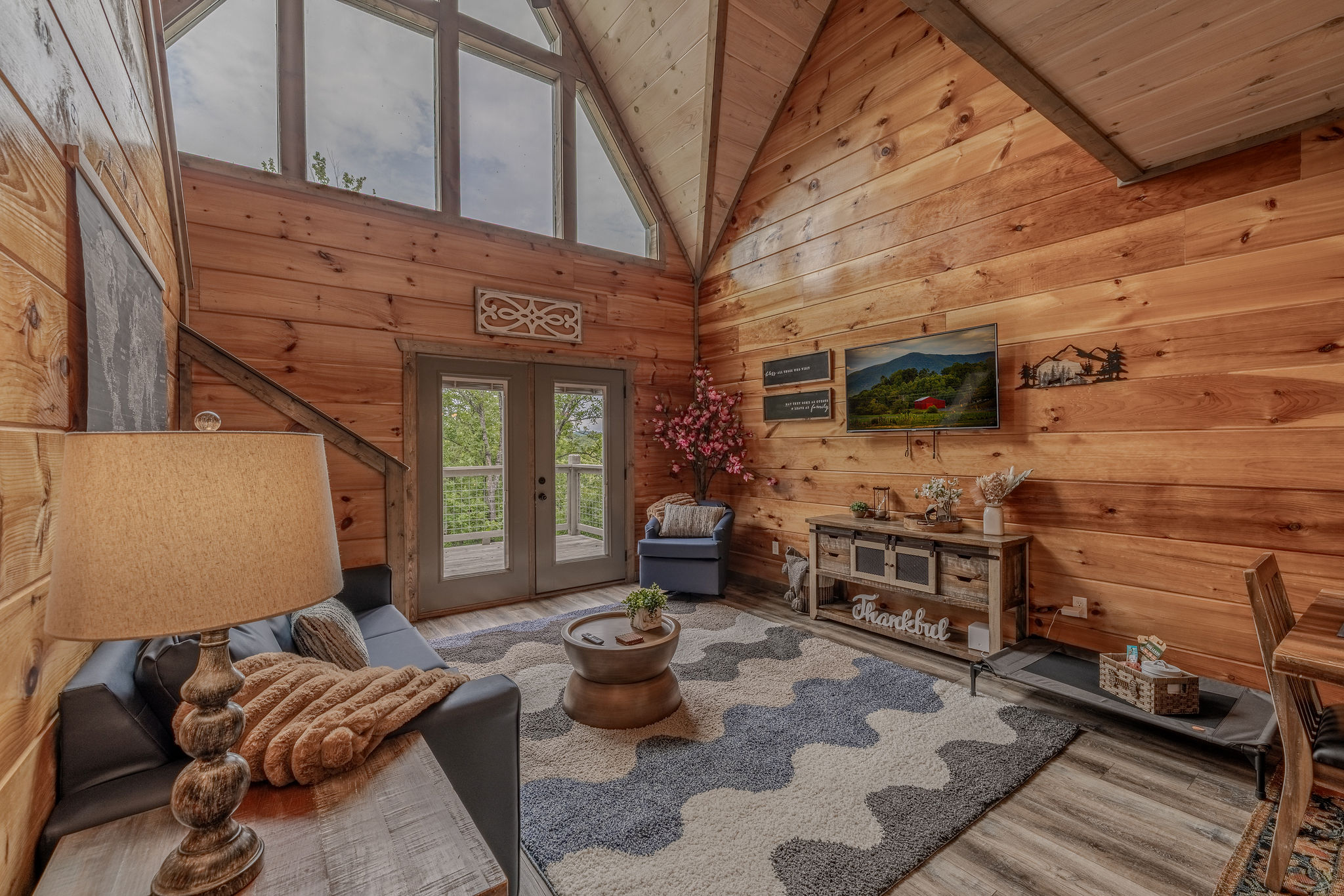 The Collector’s Gallery is the heart of the cabin, with comfortable seating and a Smart TV for group downtime.