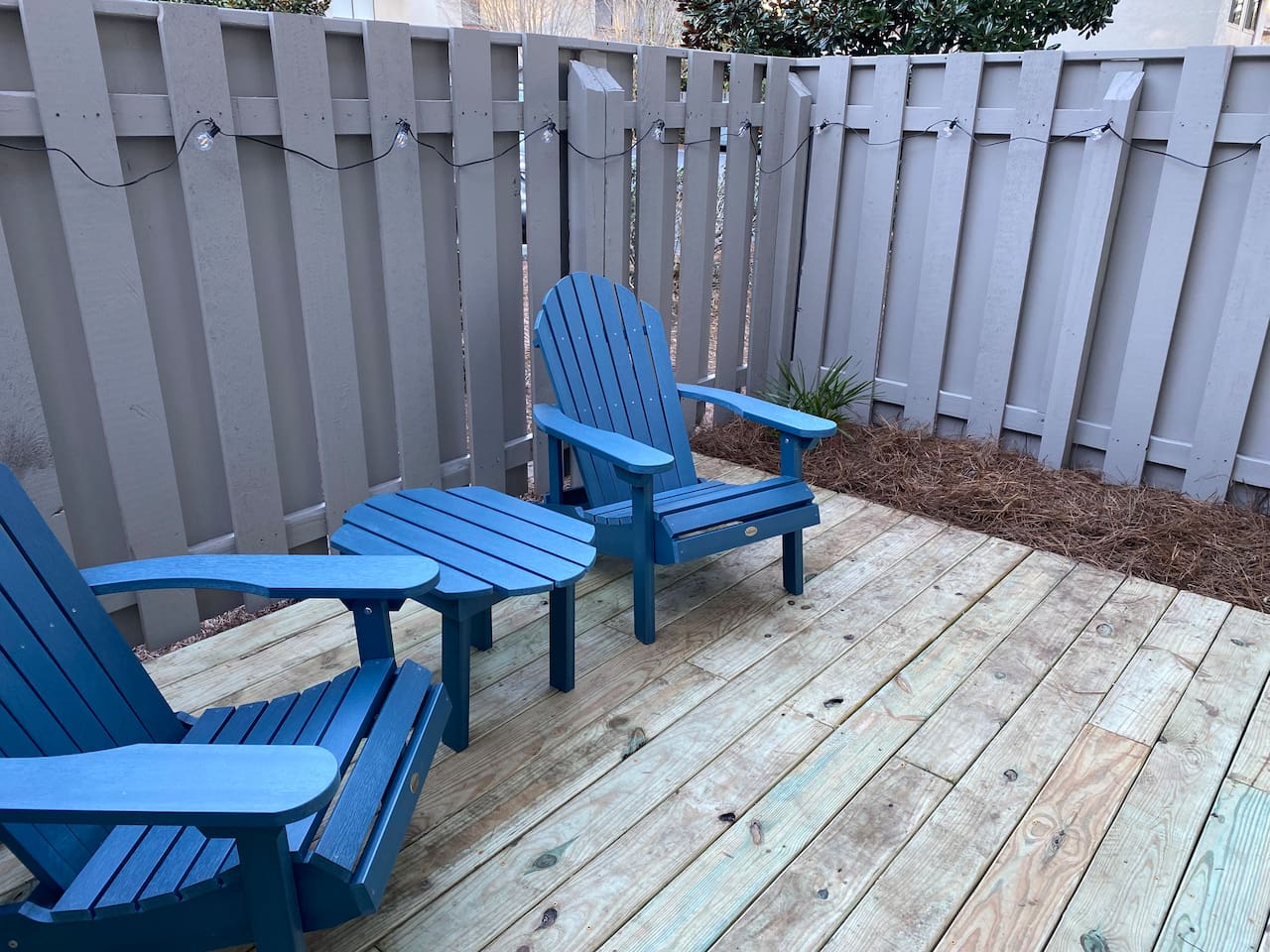Private patio with Adirondack chairs