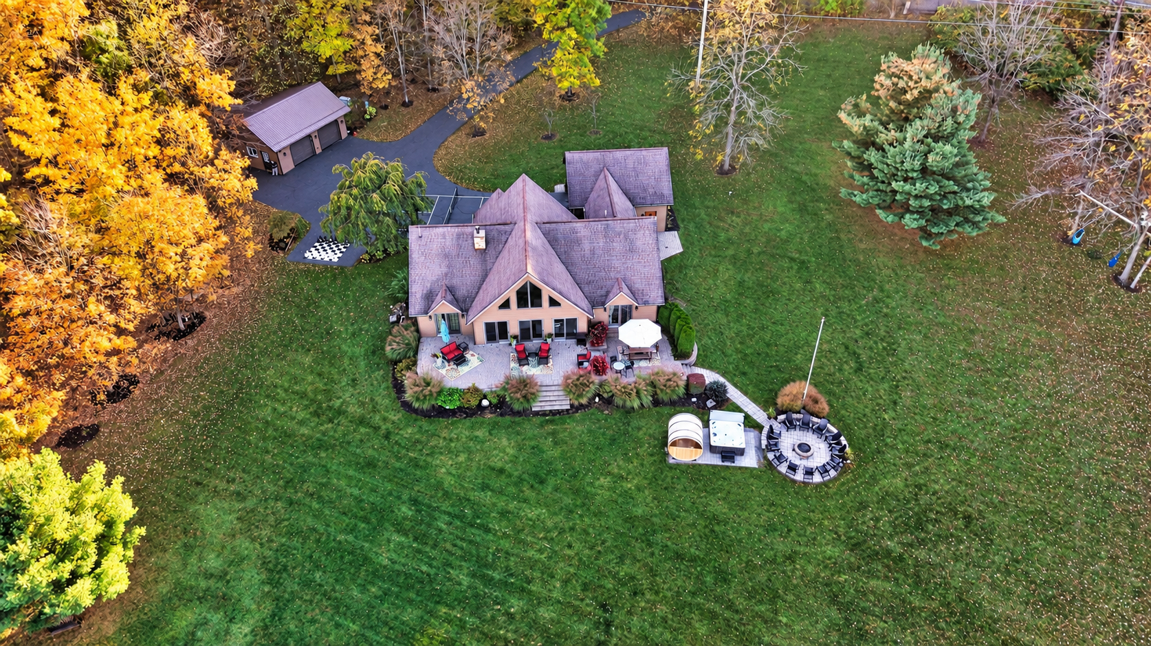 Rear aerial view showing patio and lawn