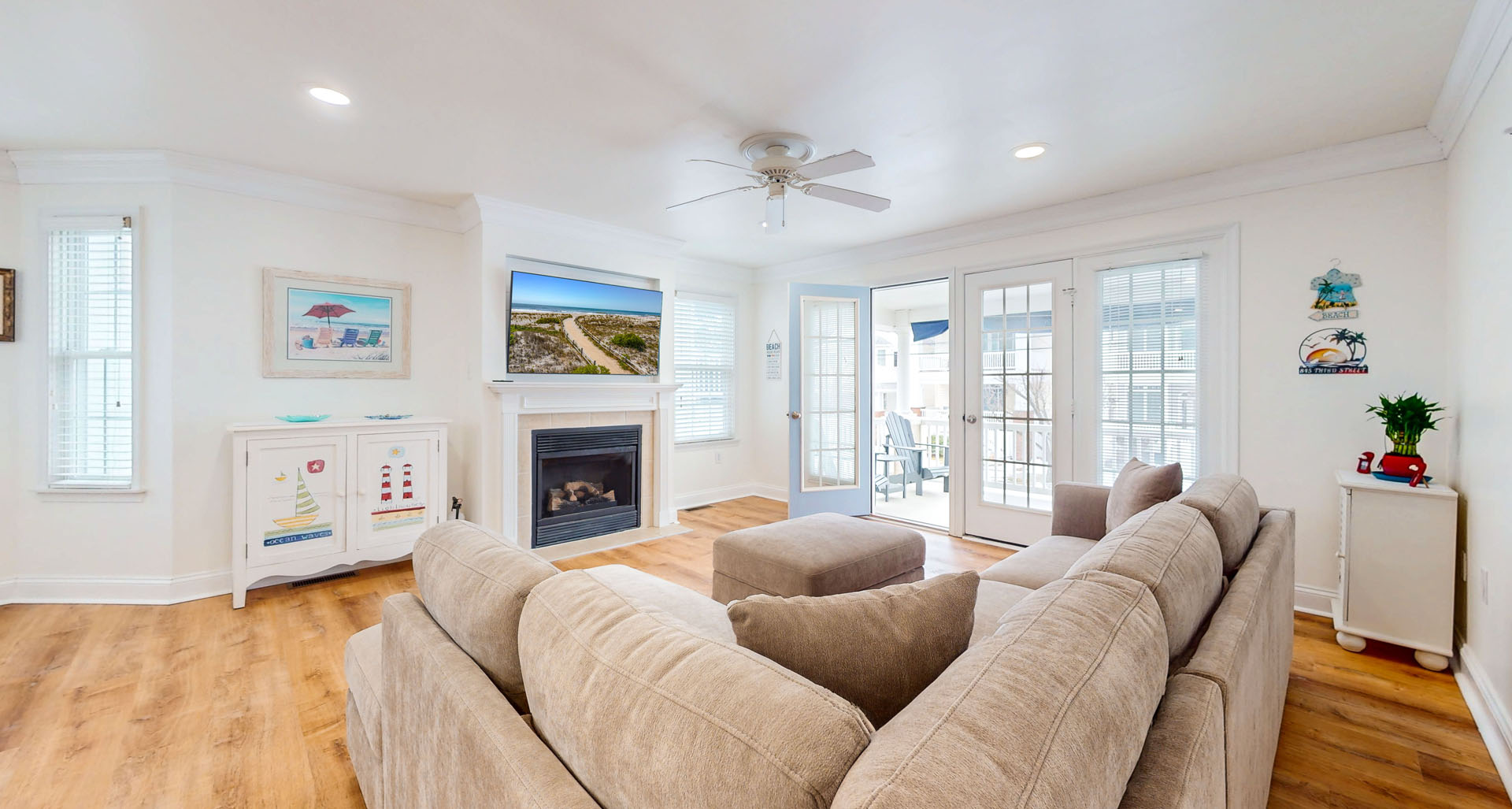 Living room area with fireplace and a flatscreen TV