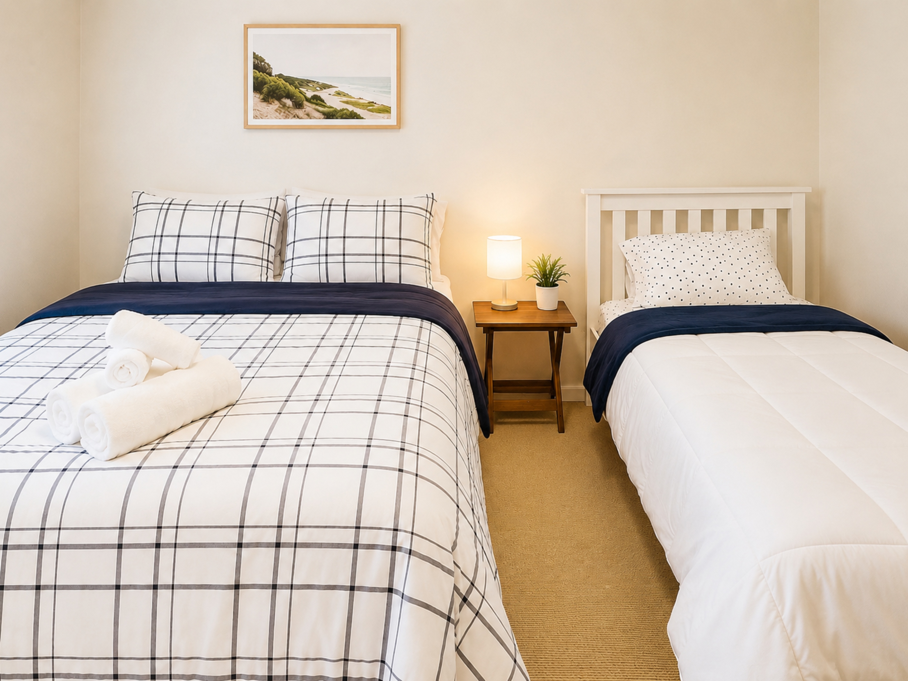 inviting and comfortable bedroom with a Queen size bed and a Twin bed