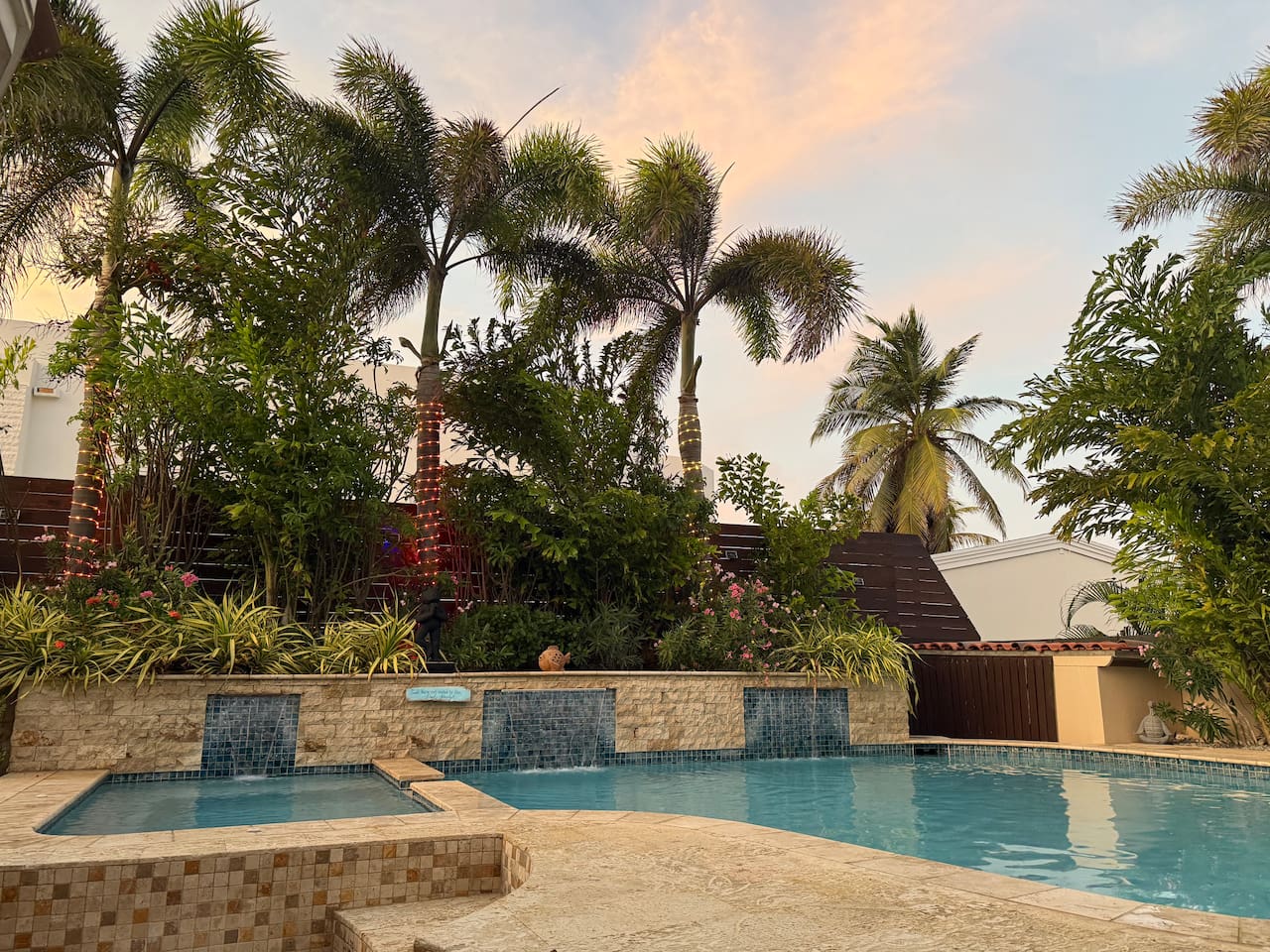Private Pool With Seating and Waterfall for cooling off.