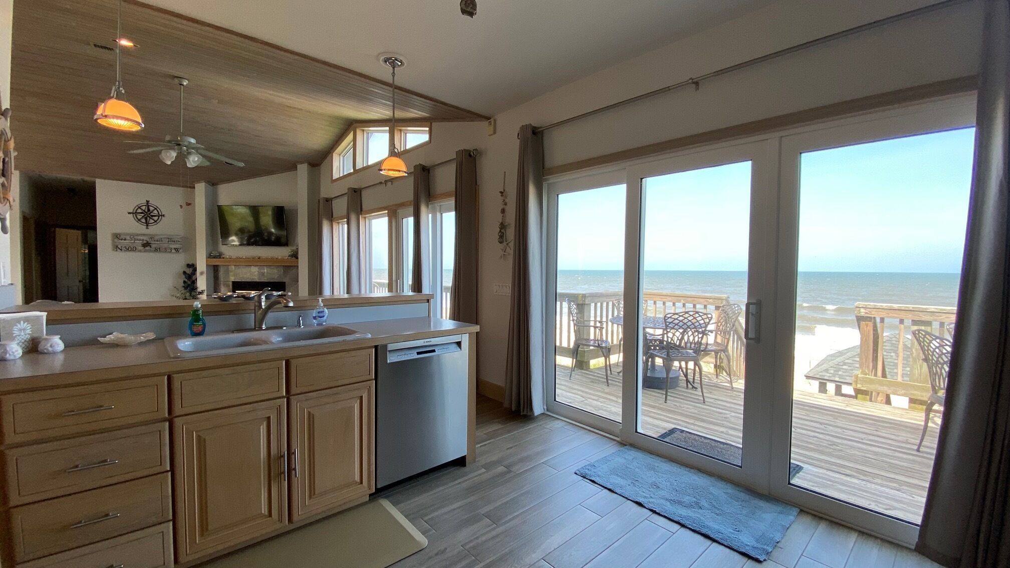 Kitchen overlooking deck and family room