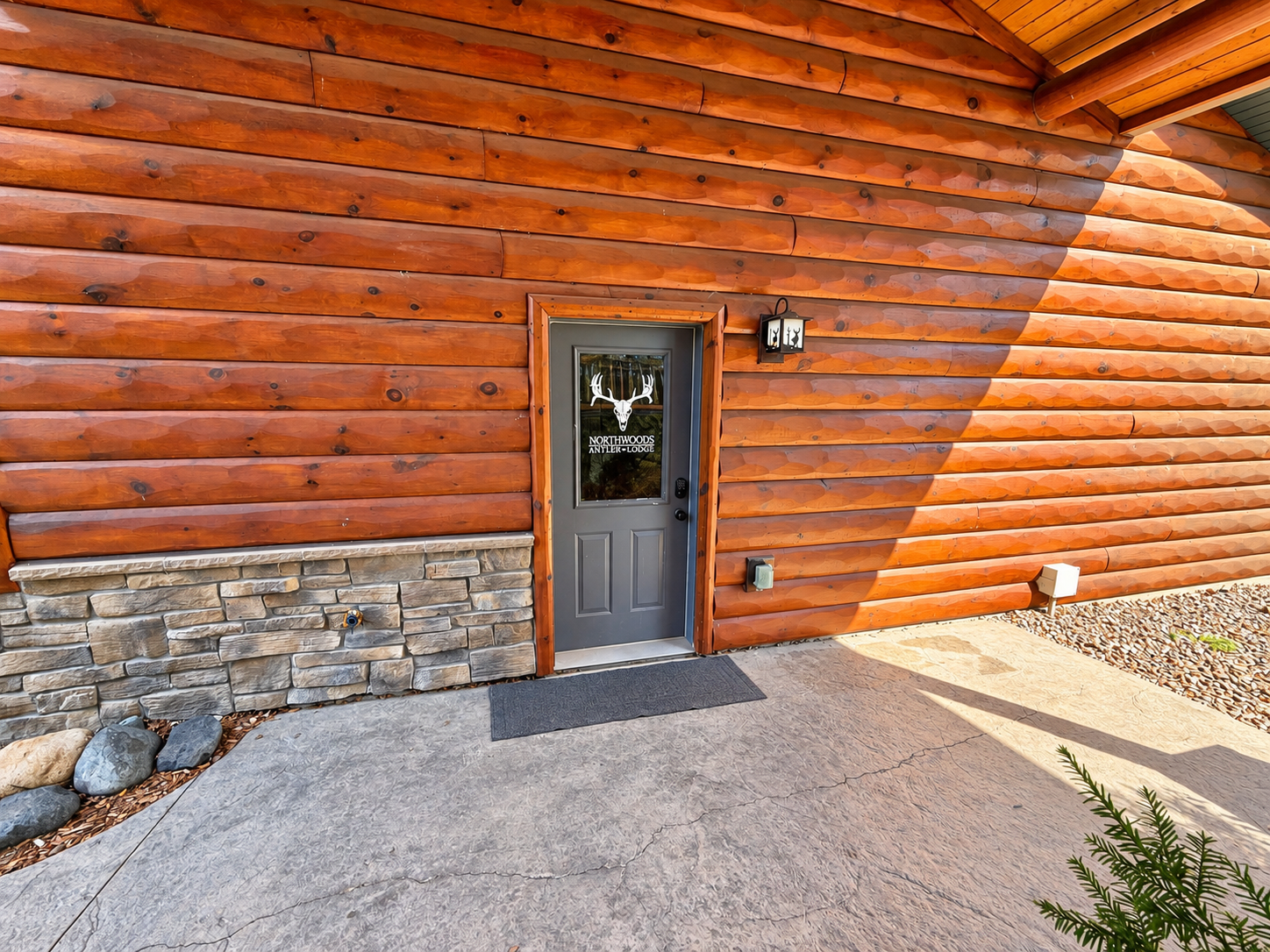 Enjoy easy, secure arrival with smart-lock access. This entrance provides convenient entry into Northwoods Antler Lodge and direct access to the attached garage.