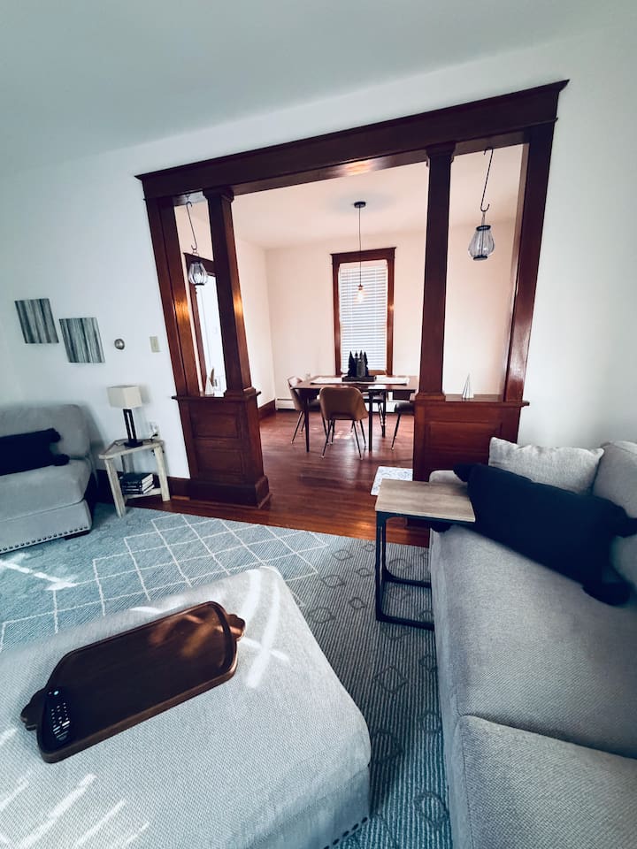 Historic charm with original woodwork connecting the living and dining spaces