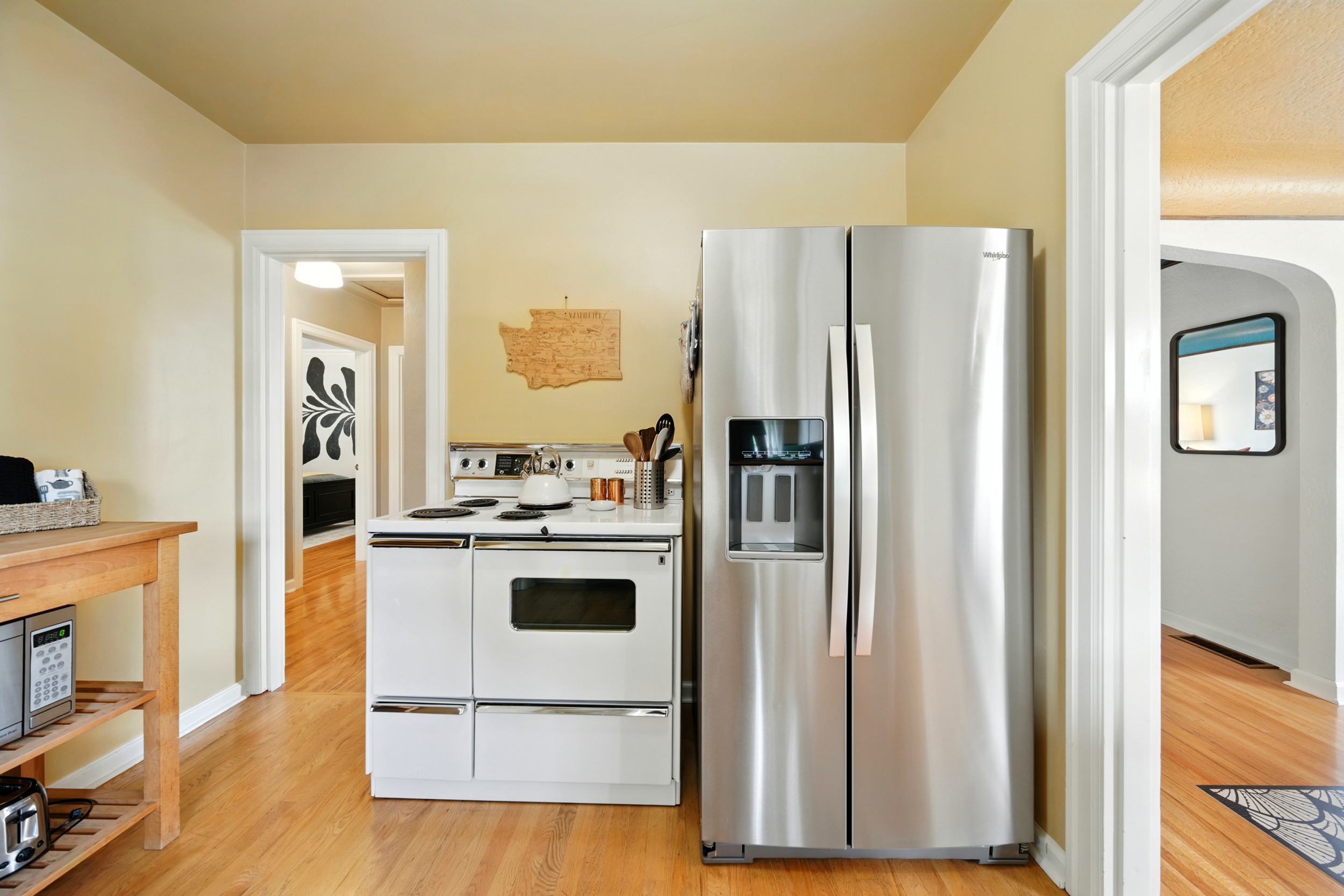 Charming, compact kitchen with a vintage, electric range.