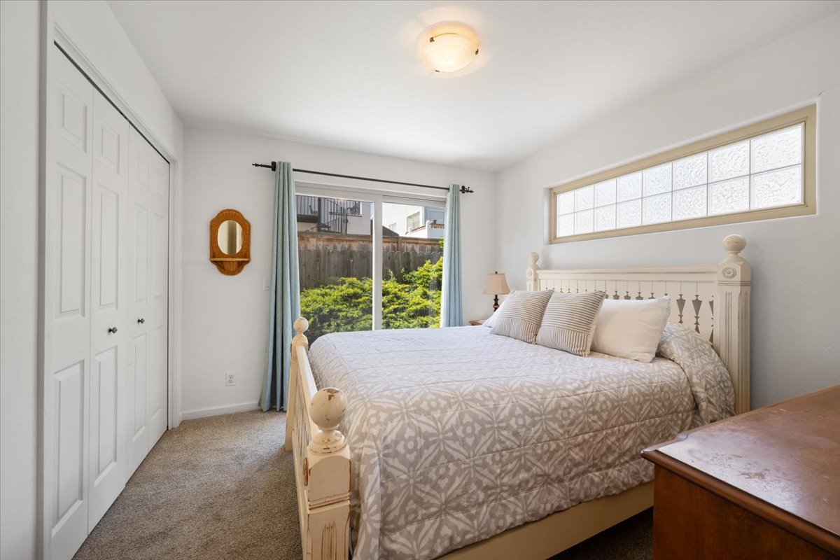 Queen bedroom with access to back patio