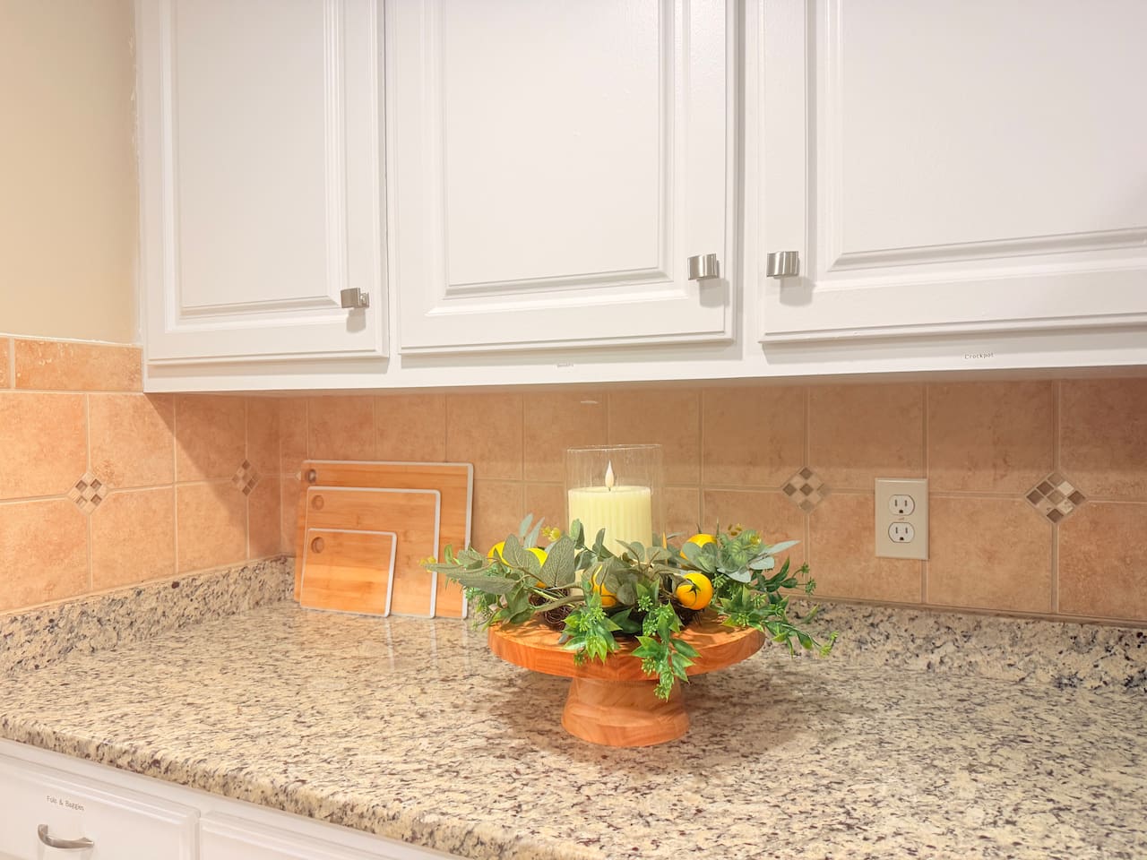 Thoughtful decor touches throughout the kitchen add warmth and style to the fully equipped space.