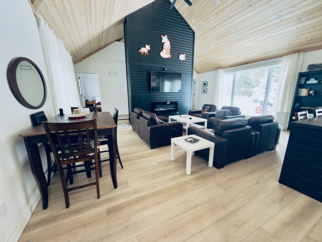 Spacious great room with dining table and cozy living room seating
