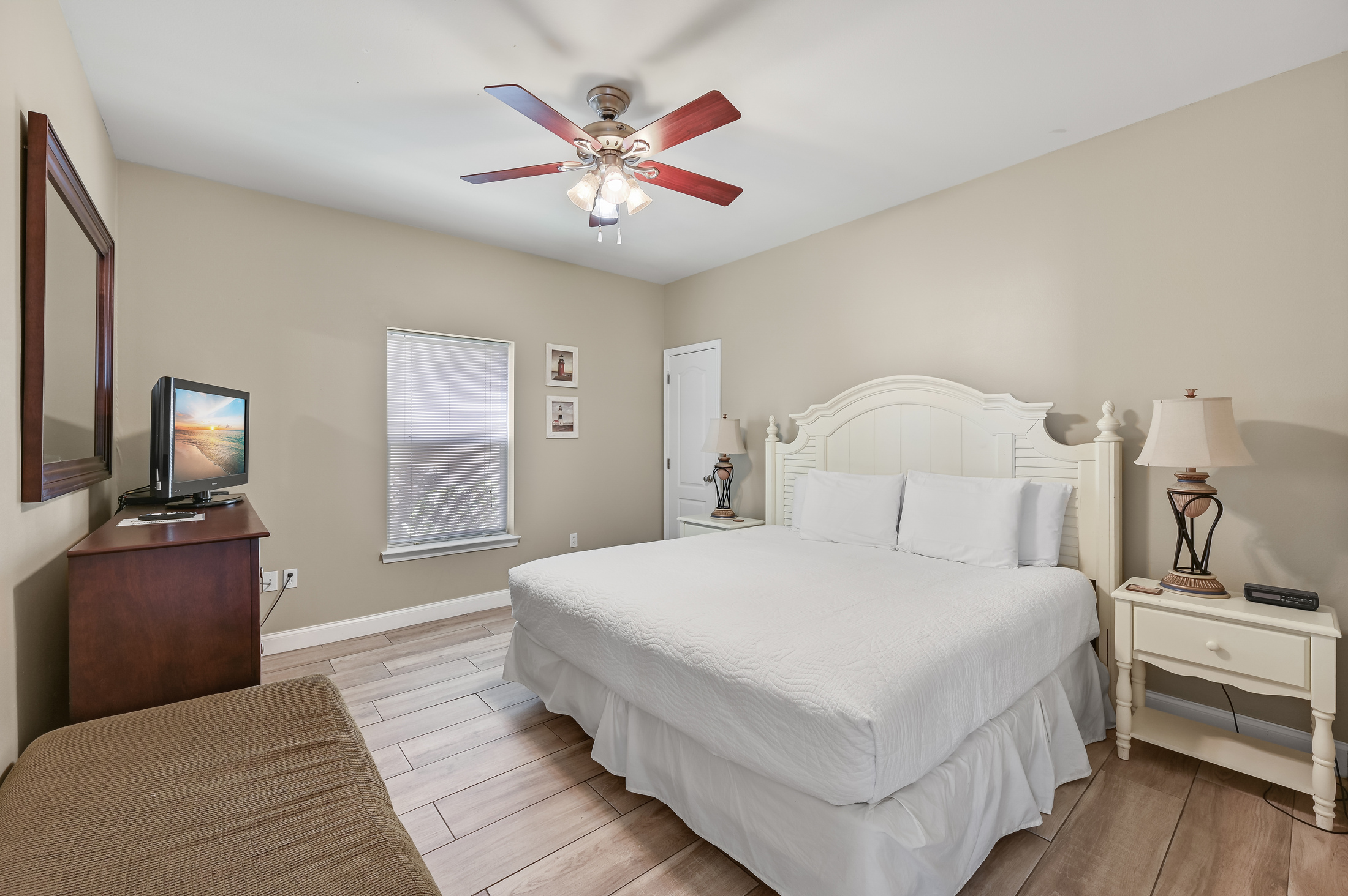 BEDROOM #1: King Bed with nightstands, dresser, and TV. (located on the 1st floor)