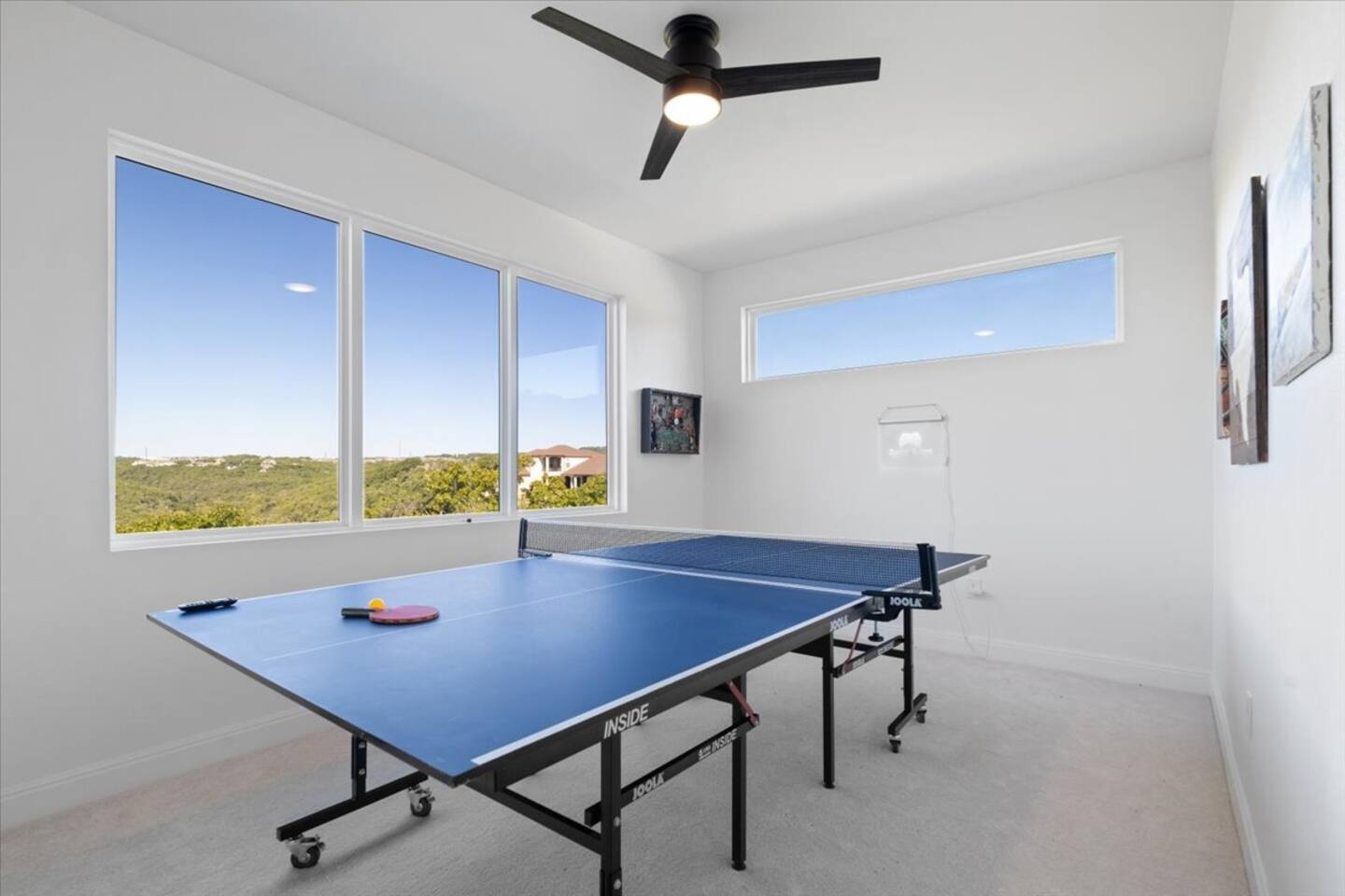 game room with hill country vview