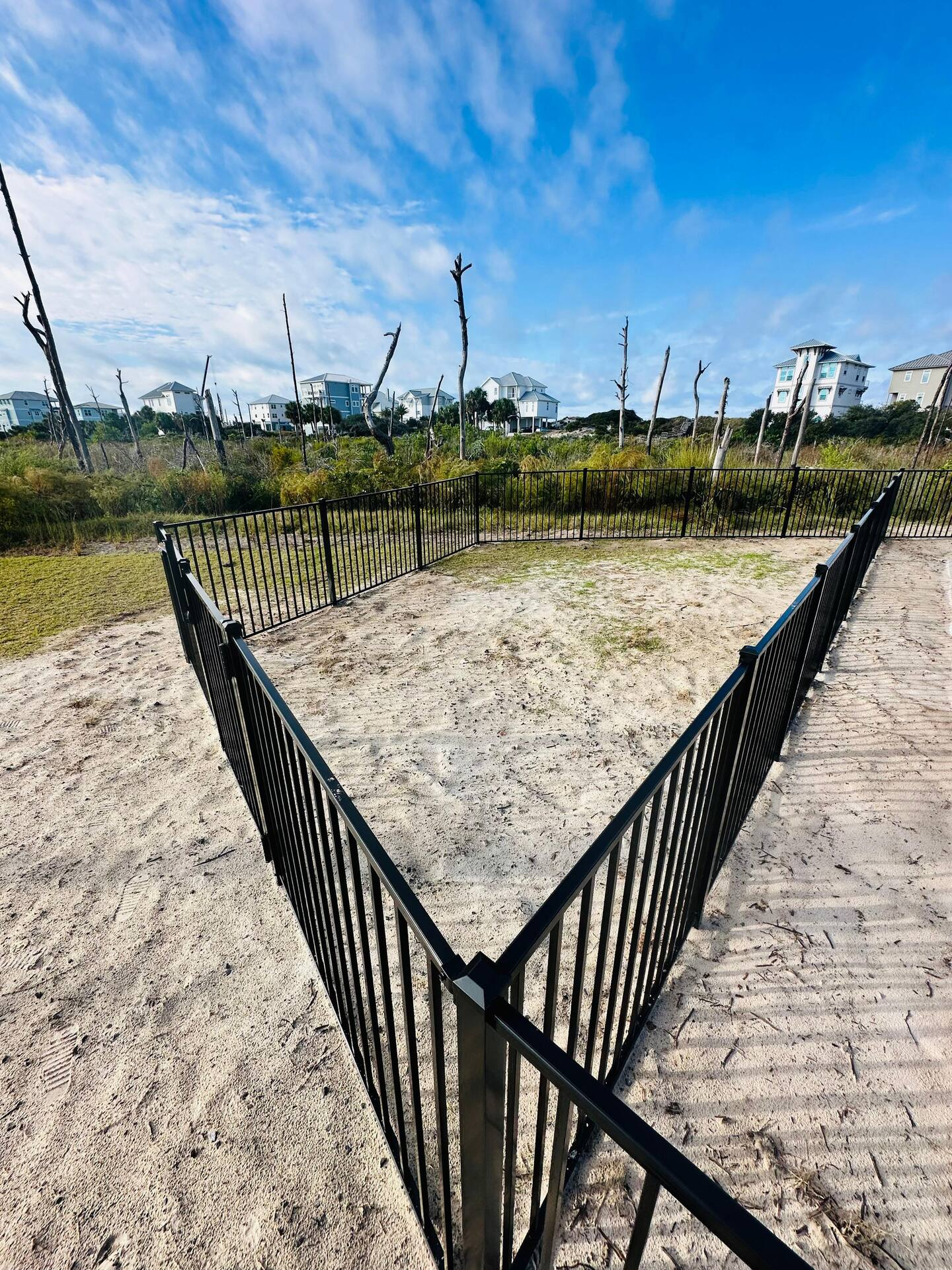 A private fenced dog run offers a safe space for your furry companions to play, soon to be freshly sodded for added comfort and convenience.