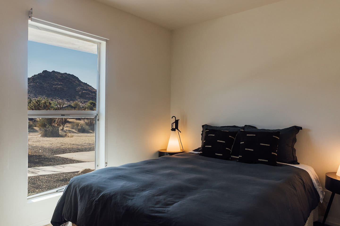 Small bedroom with window facing the front of the home.