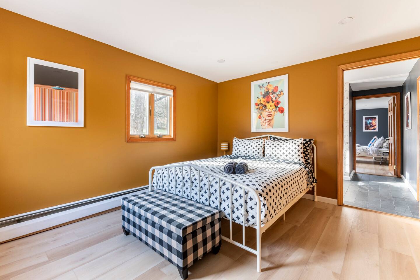 2nd bedroom with ottoman storage. Door exits to office area.

Queen Hybrid Performance Firm Top Mattress Sealy Immersion™ Advanced Memory + Posturepedic Technology. Guests have commented favorably.