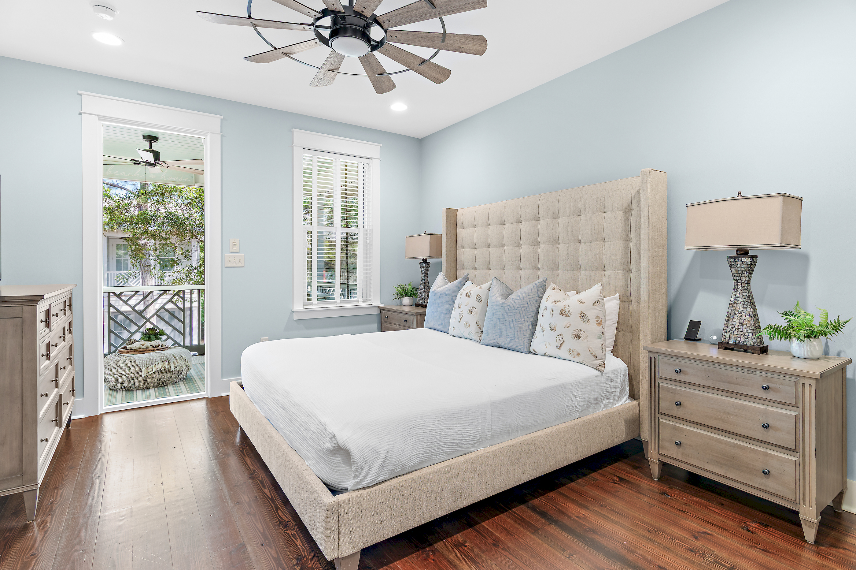 Upstairs master suite with tranquil views and soft linens.