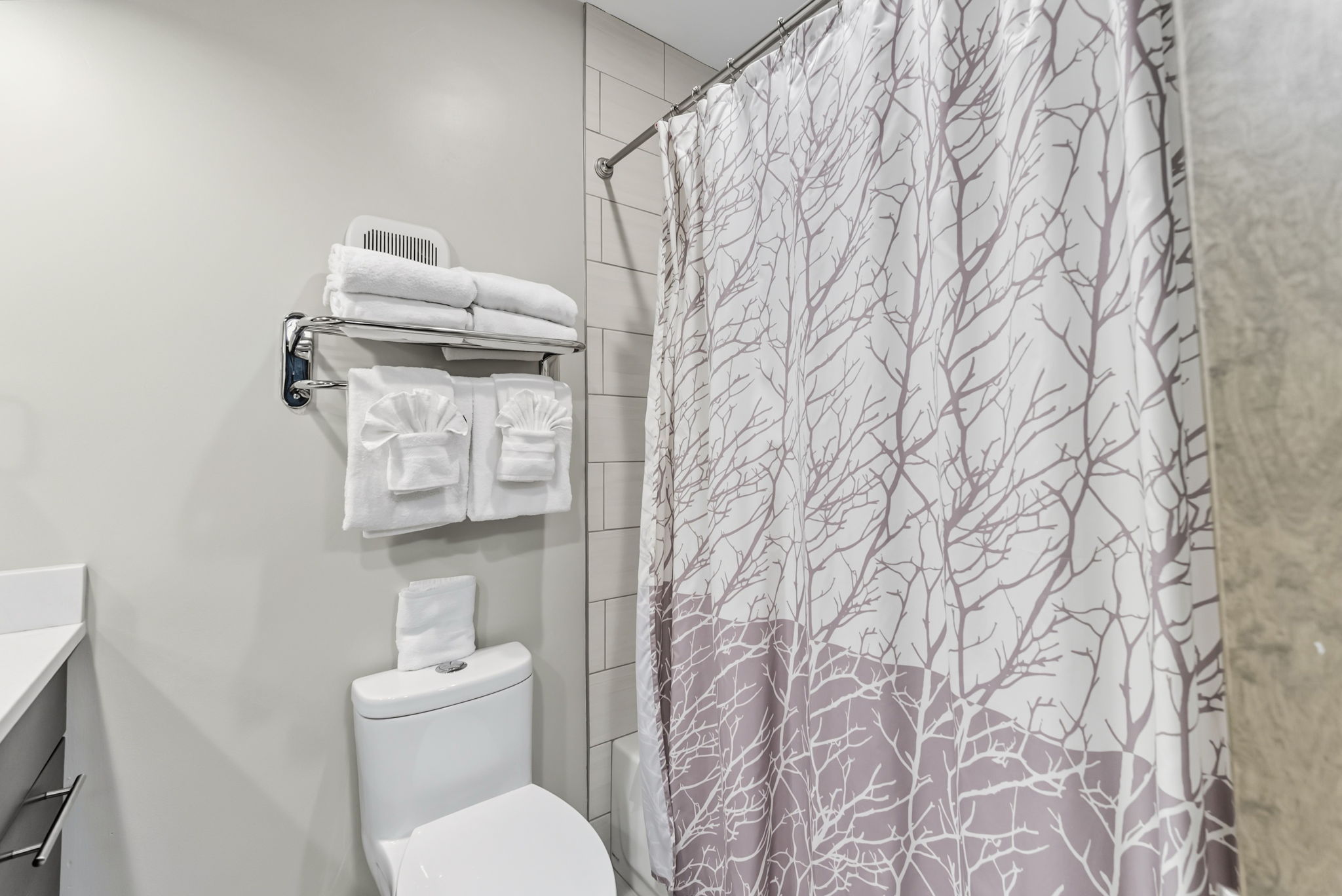 Full bathroom with two sinks, tub/shower