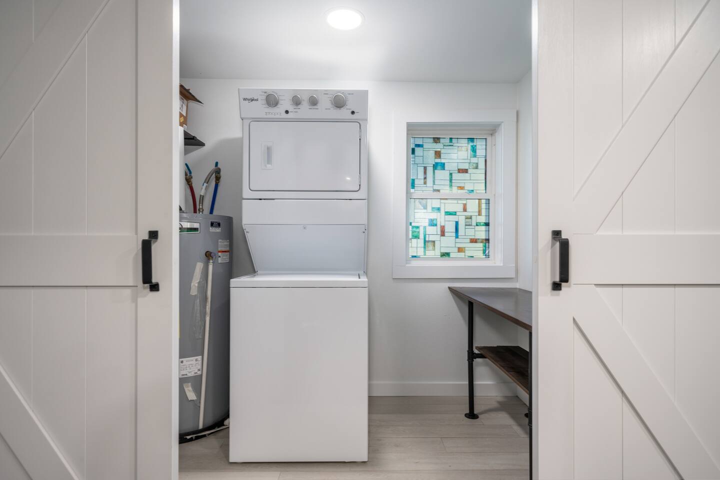 Laundry Room with washer and dryer and soap pods, folding table