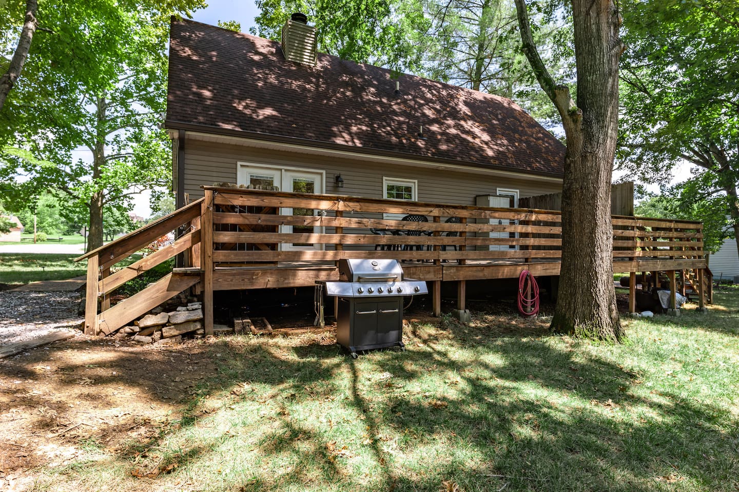 LARGE back deck directly off of the driveway.  Propane grill for your convenience. 