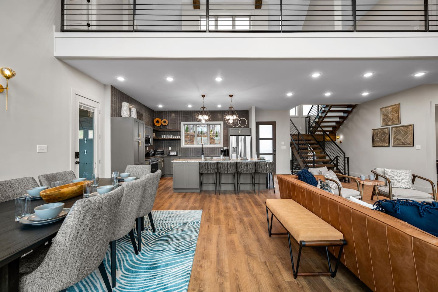 Welcome to the cozy entry-level kitchen and dining room! Take a look at the charming stairs that lead you to the other inviting levels of the home.