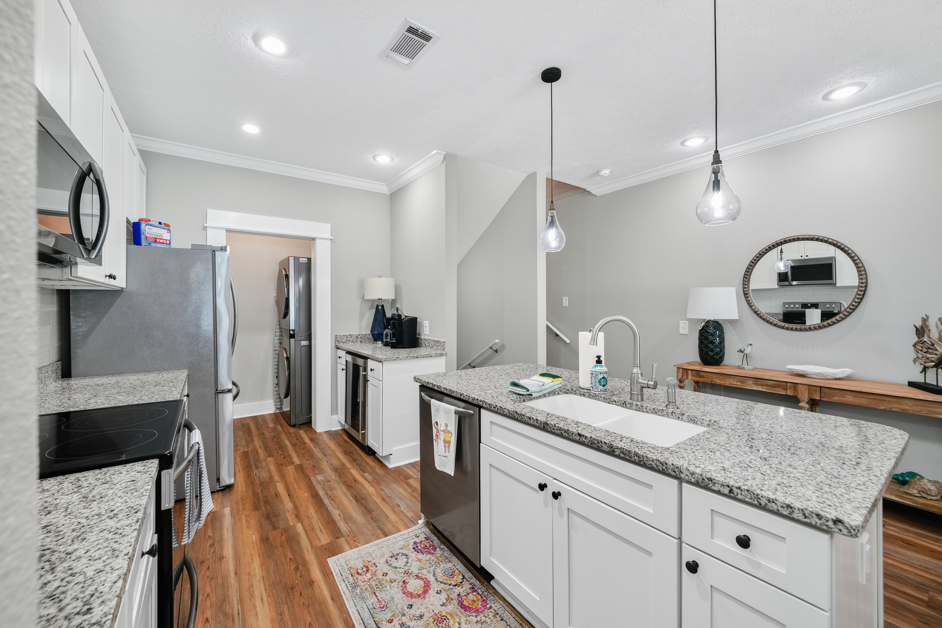 Spacious open-concept kitchen and dining area with a large island, modern appliances, ample seating, and plenty of room to gather