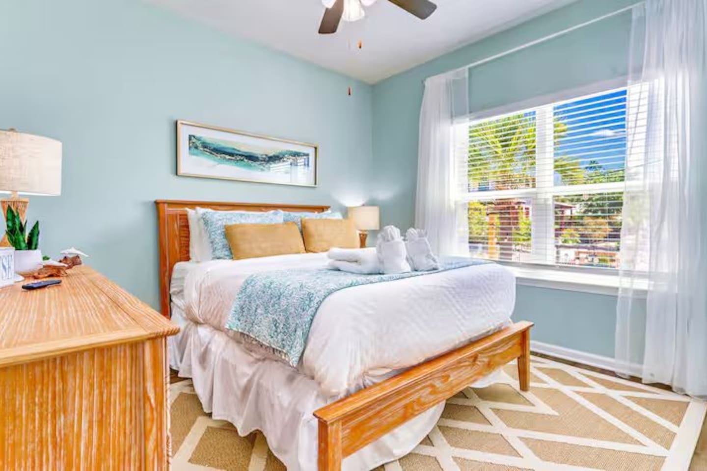 Bedroom 3: Unwind in this inviting queen bedroom featuring soft linens, natural light, and peaceful beach-inspired decor