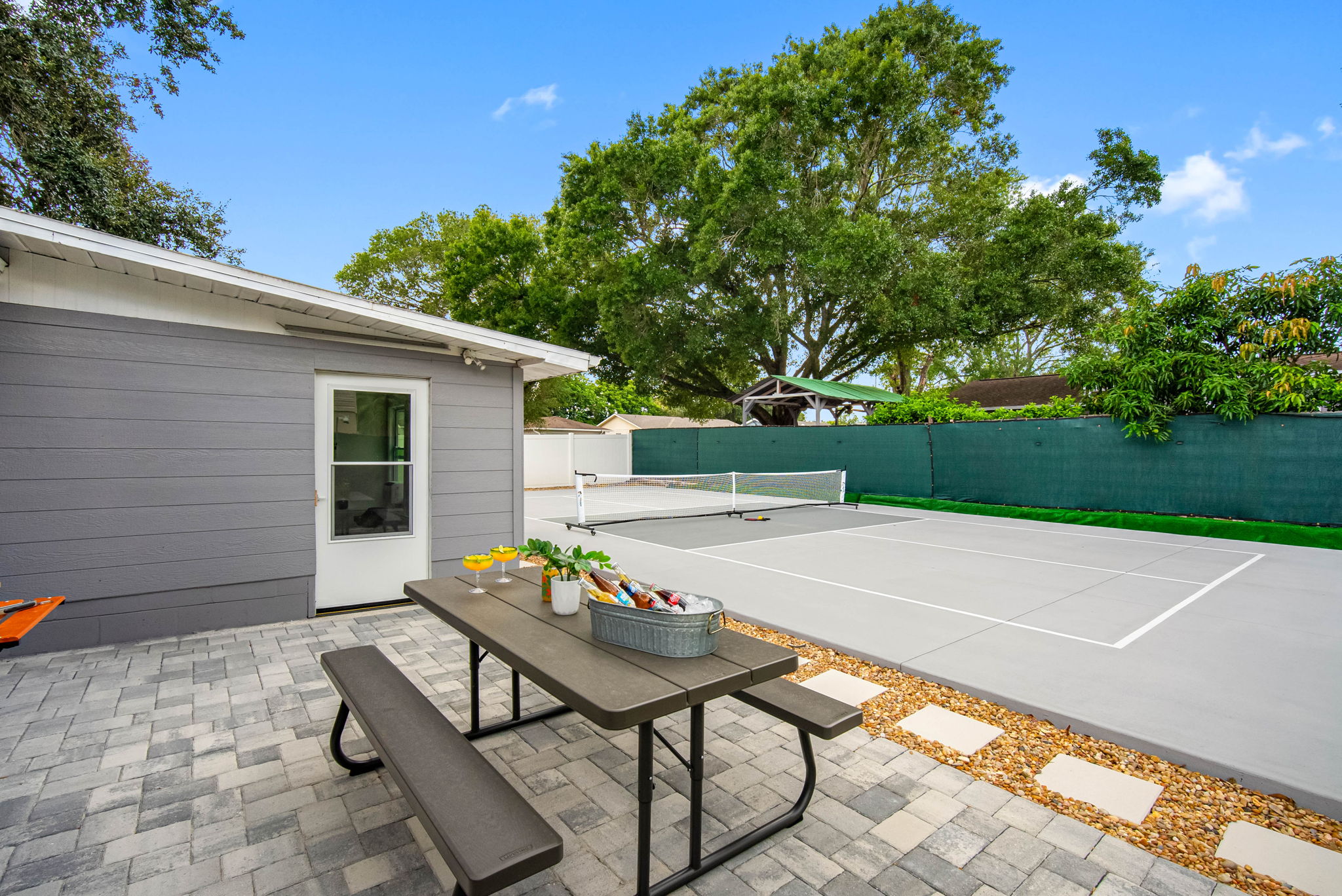 Clean pavers, cool drinks, and hot meals make this space a guest favorite.