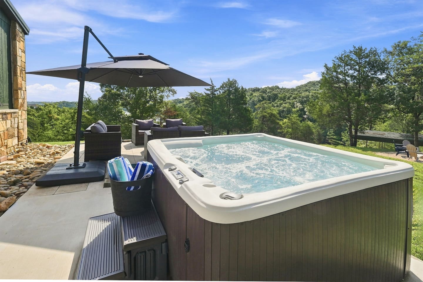 Soak, unwind, and take in the peaceful lake and mountain views from your private hot tub.