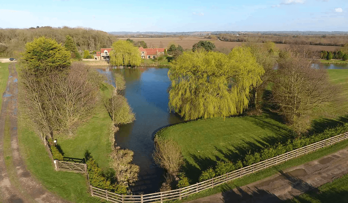 Gorse Lodge main house view across the lake