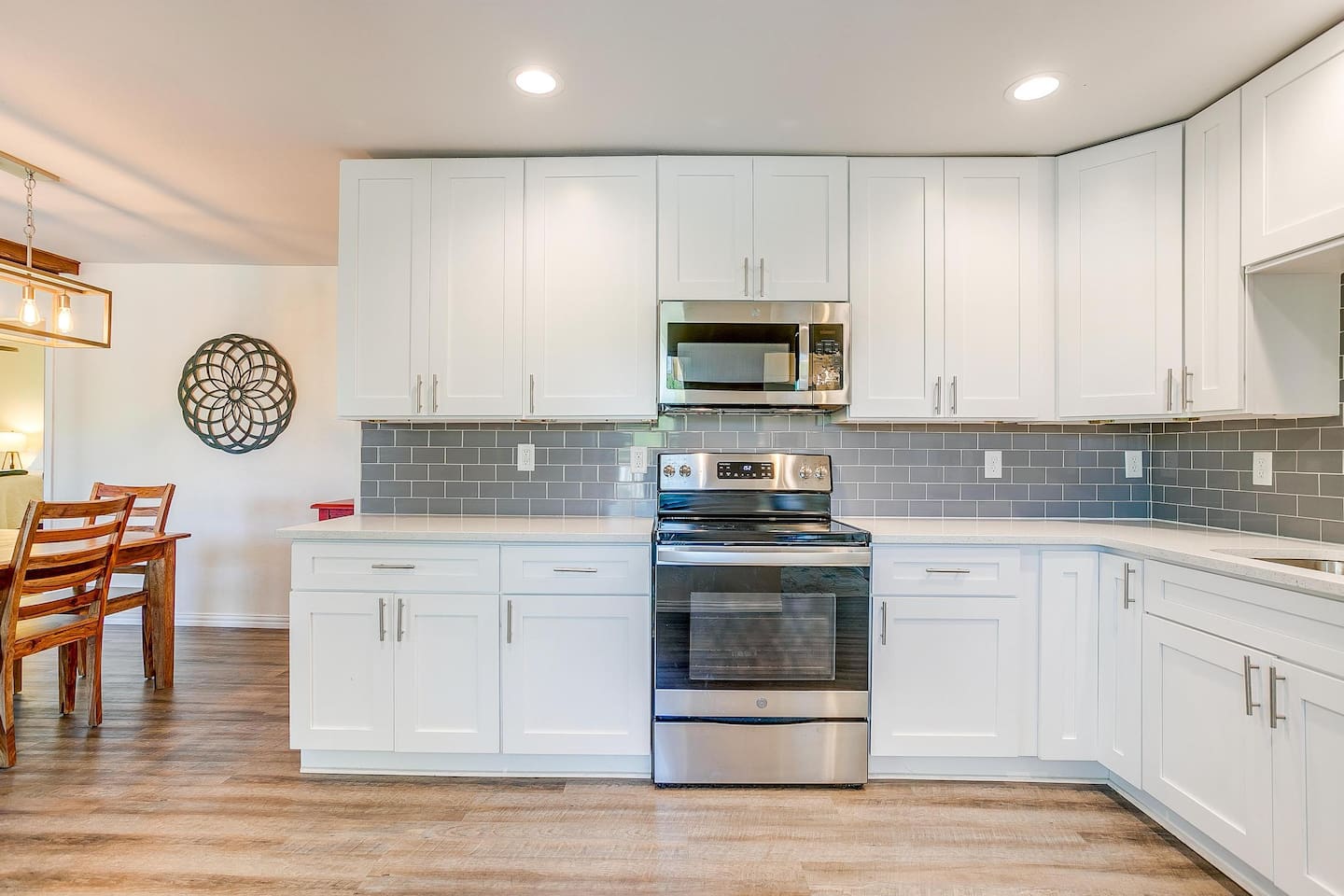 Bright, modern kitchen with stainless appliances and spacious countertops — fully equipped for cooking and entertaining.