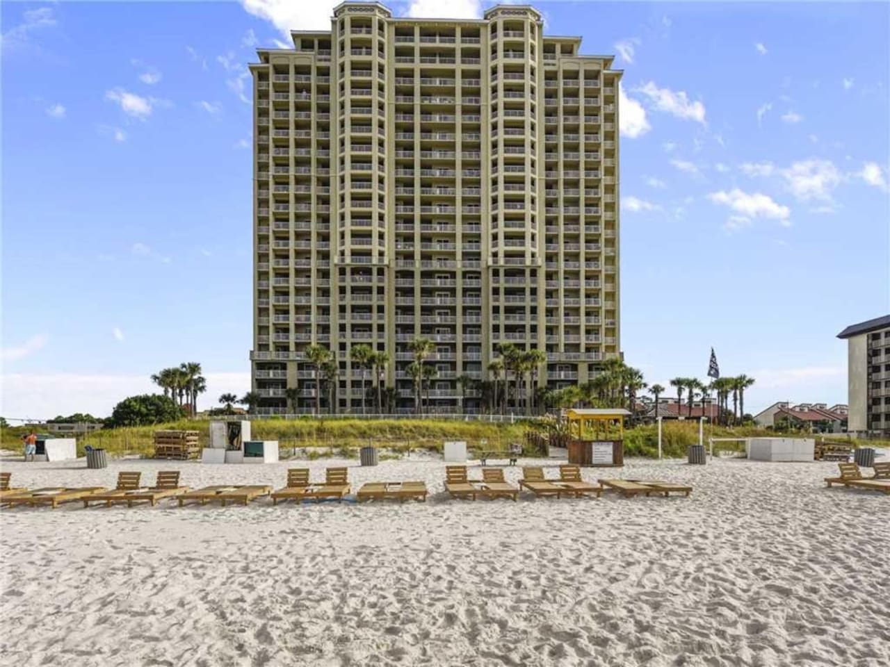 View of the condo as you are  walking back from taking a dip in the ocean. 
