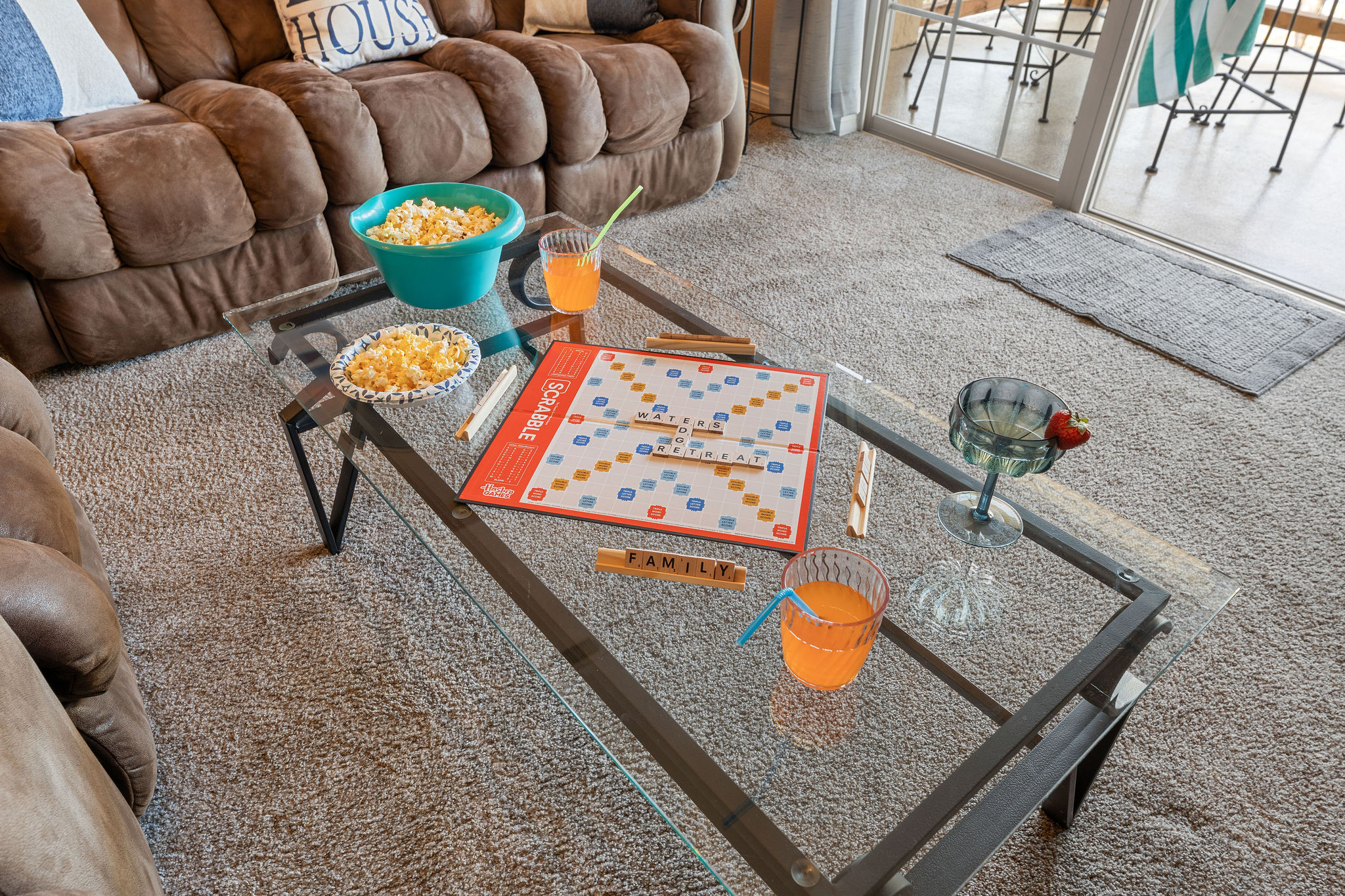 Family game time with the sound of boats going by and waves lapping at the shore