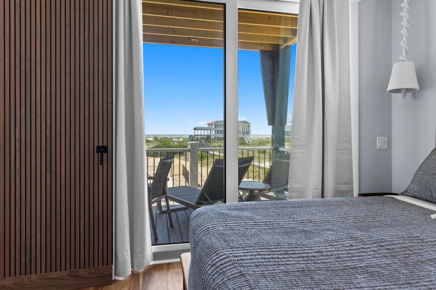 Oceanfront bedroom with direct access to lounge chairs and sea breezes? Yes please! This bedroom will definitely be a favorite!