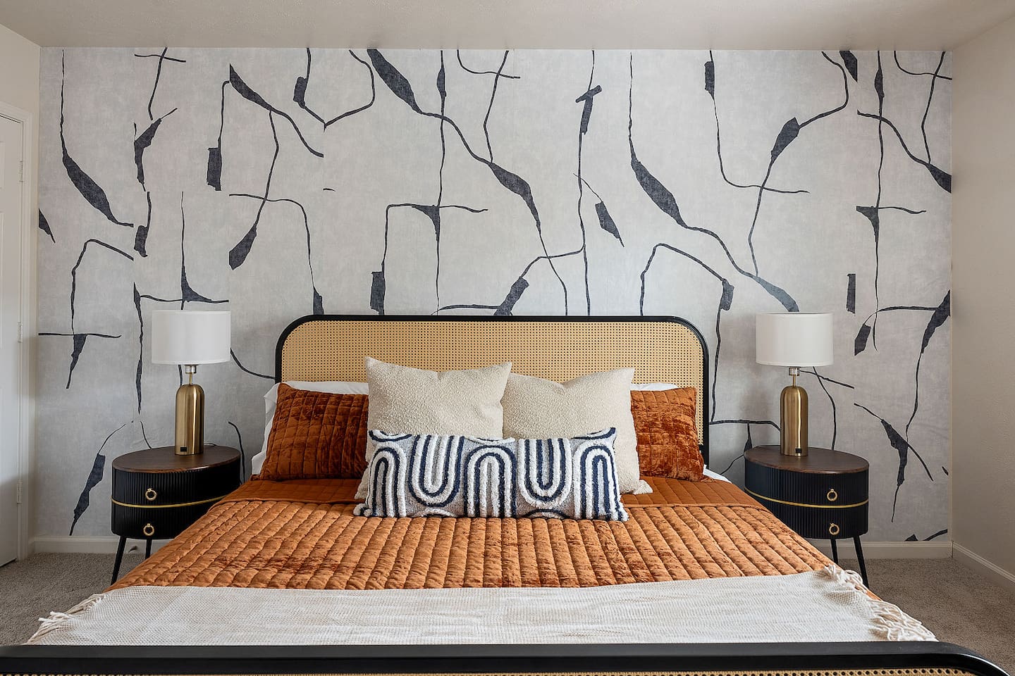 Relax in this trendy bedroom, which includes a comfortable bed and one-of-a-kind wall décor. A comfortable environment for a good night's sleep.